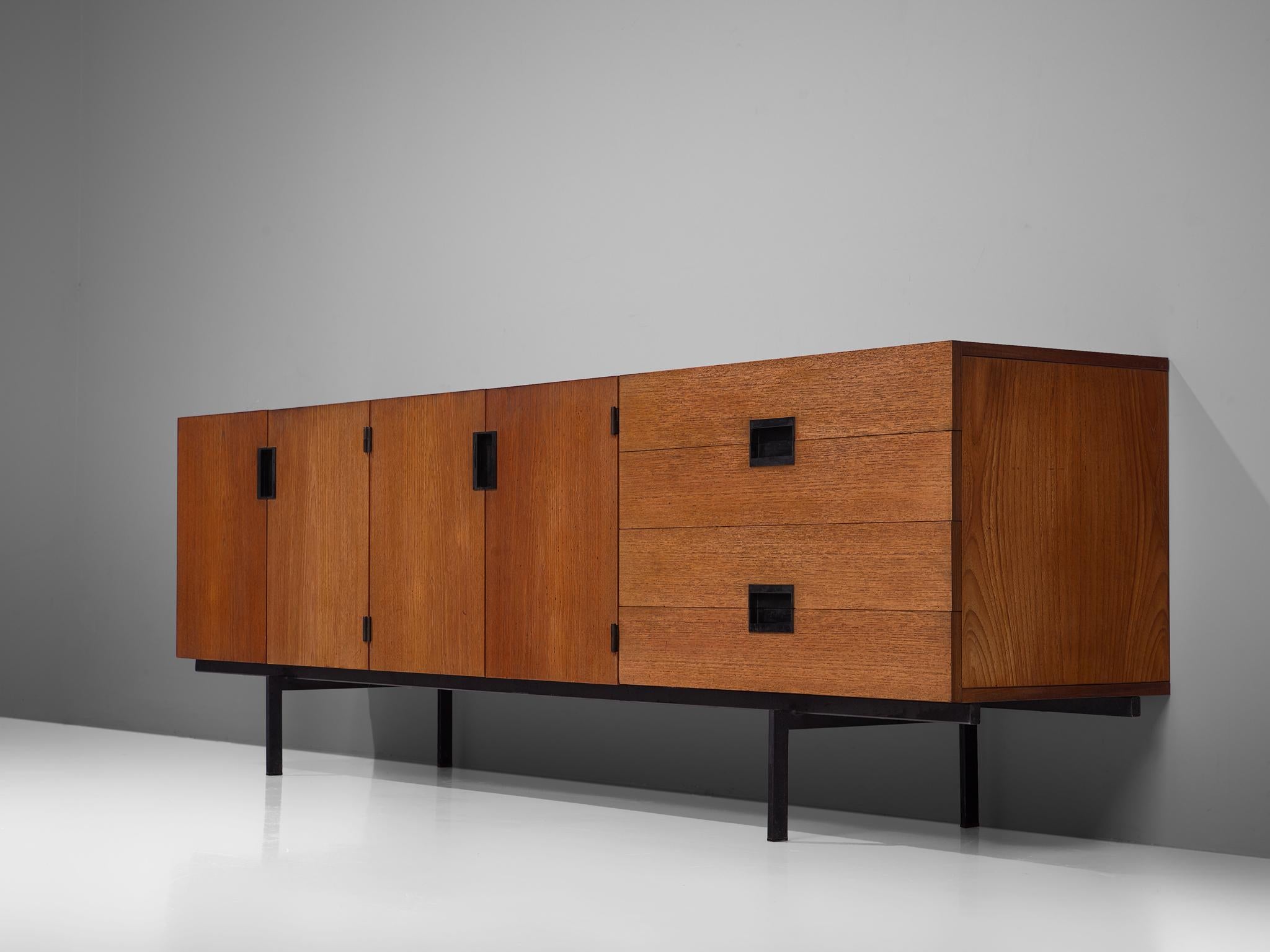 Cees Braakman for UMS Pastoe, sideboard model DU03, teak and metal, by The Netherlands, design 1958, production 1960s

Elegant and modest teak sideboard by Cees Braakman for UMS Pastoe. This sideboard consists of a small metal base, which creates