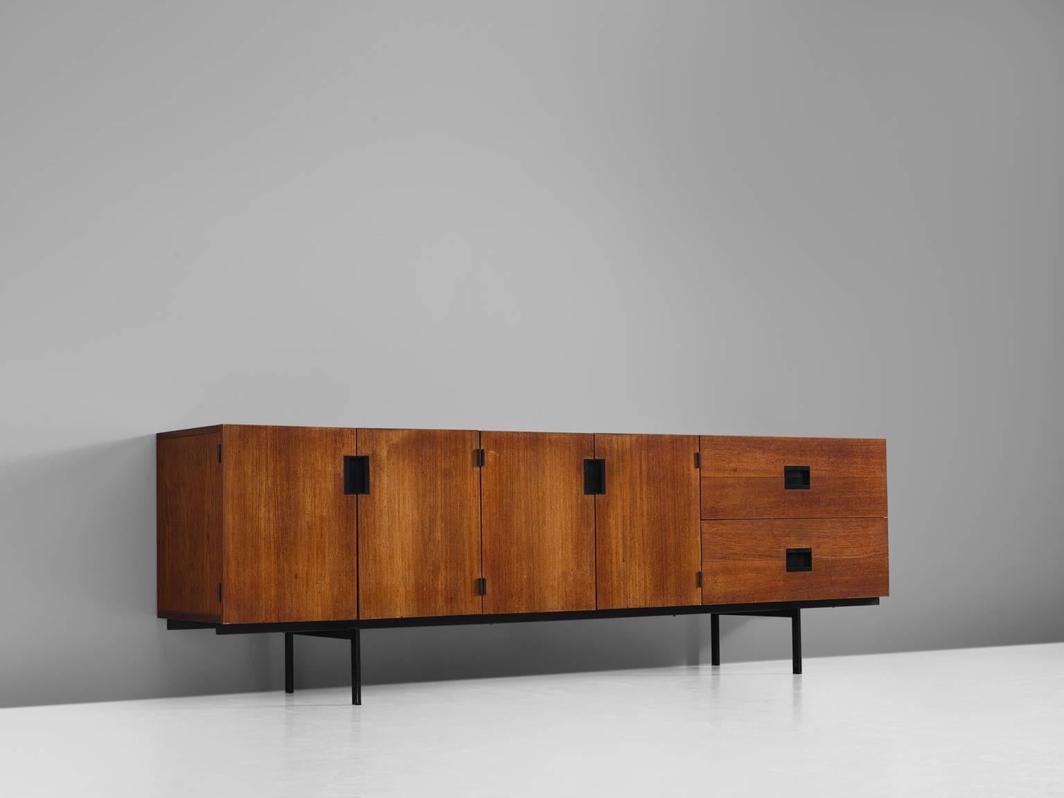 Sideboard model DU03, in teak and metal, by Cees Braakman for UMS Pastoe, The Netherlands, design 1958, production 1960s.

Elegant and modest teak sideboard by Cees Braakman for UMS Pastoe. This sideboard consists of a small metal base, which
