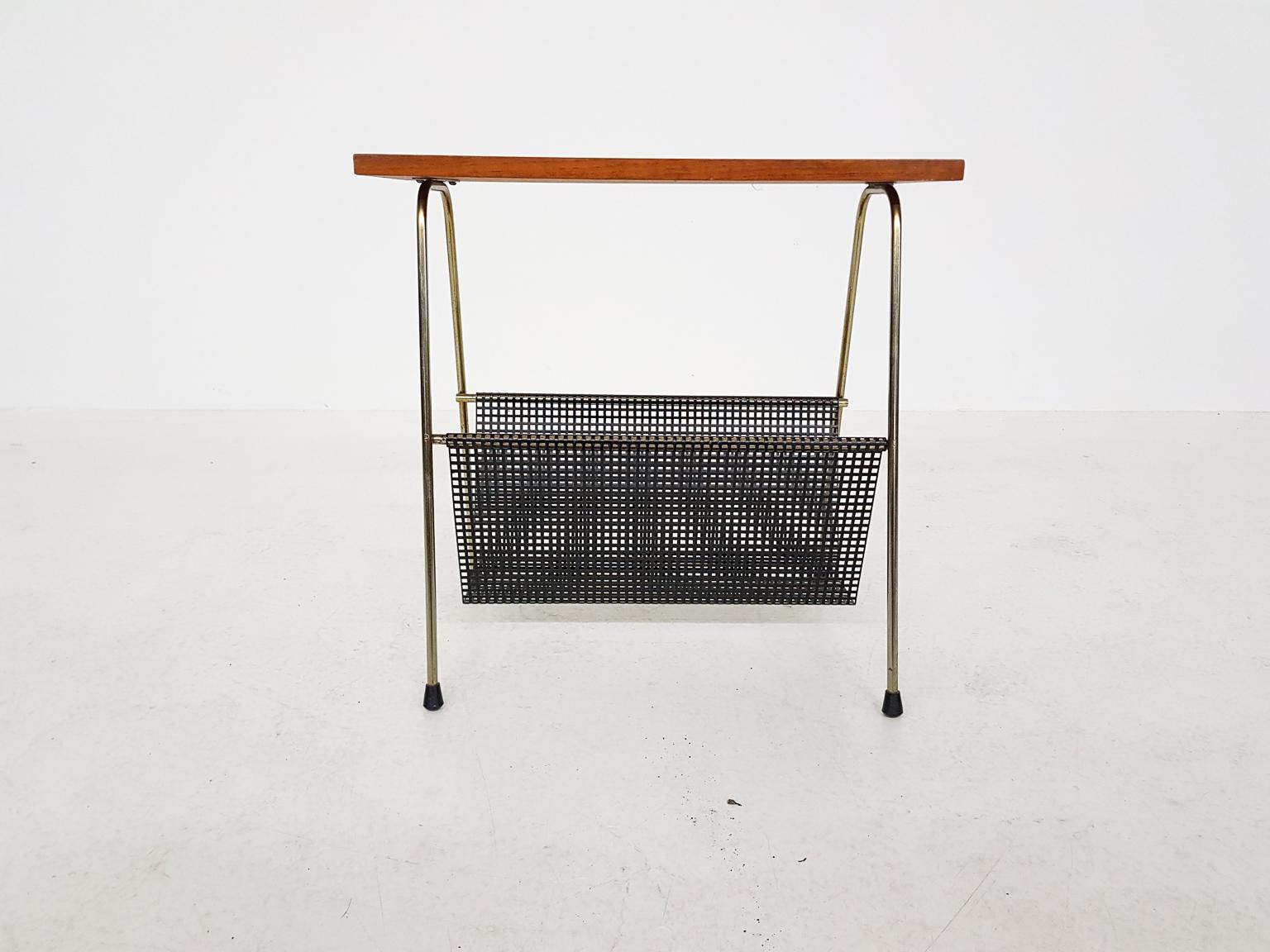 Nice side table or magazine rack. It has many similarities with the TM series side tables or magazine racks by Cees Braakman for Pastoe the Netherlands.

Cees Braakman was a Dutch furniture designer who worked for UMS Pastoe in the midcentury. He