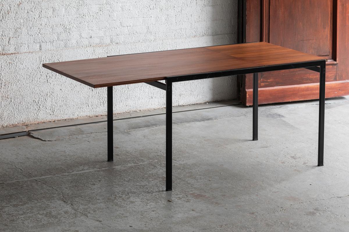 TU11 dining table designed by Cees Braakman and produced by Pastoe in the Netherlands around 1960. This piece is part of the Japanese series. The frame is made of black metal and the table top in teak veneer. This table is extendable from 120 to