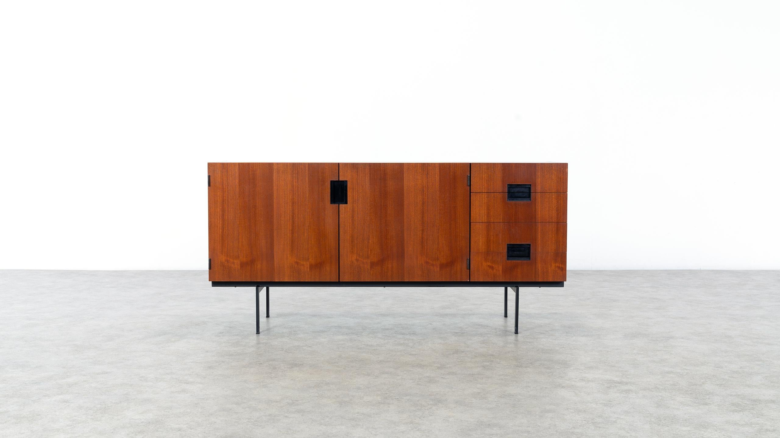 Minimalist sideboard designed by Cees Braakman for Pastoe, the Netherlands, 1958. 

This highly collectable DU-01 sideboard is regarded as a true icon of Dutch midcentury design.
The sideboard has an outstanding clean geometrical design with a