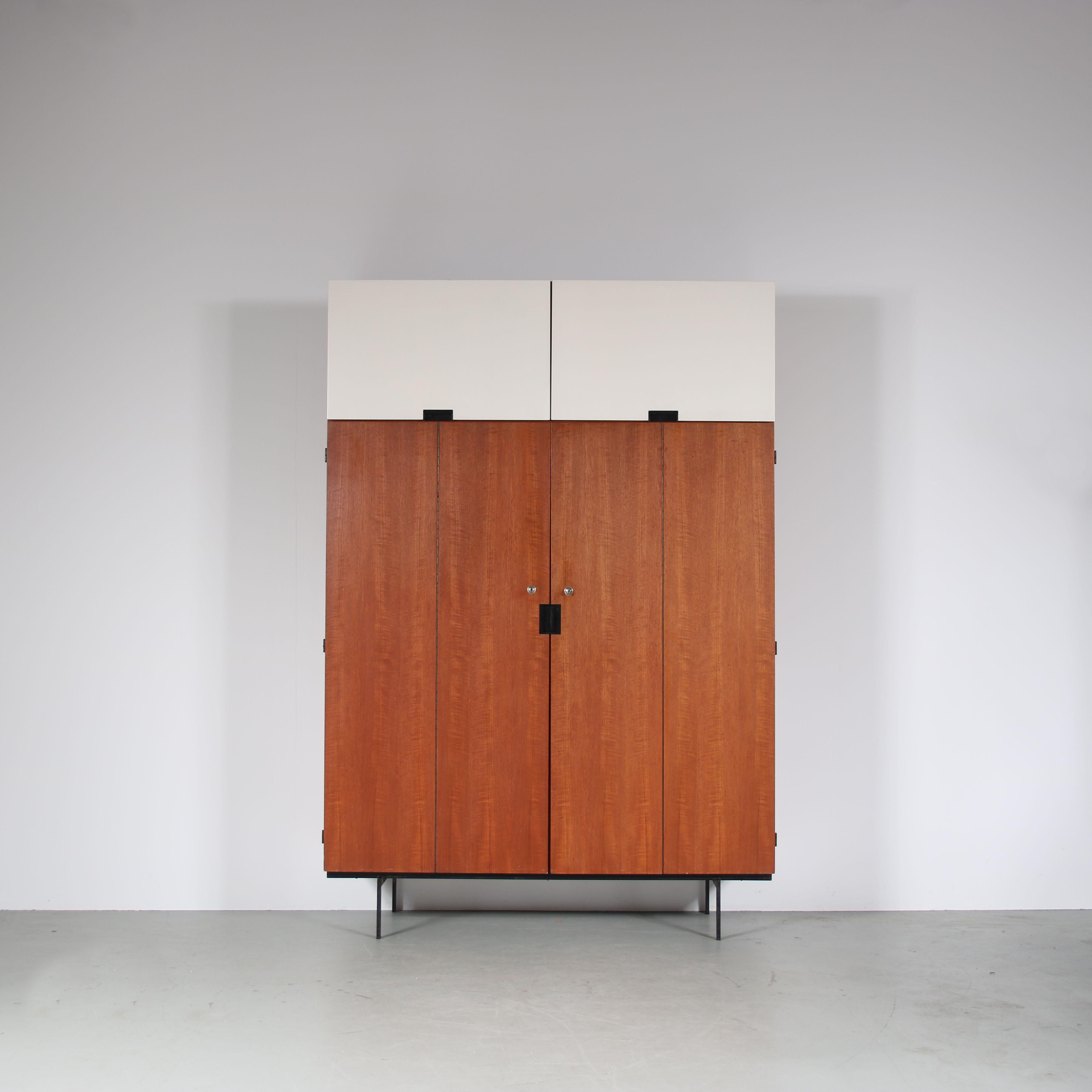 A fantastic wardrobe, model KU10 from the Japanese series designed by Cees Braakman, manufactured by Pastoe in the Netherlands, circa 1950.

This iconic and much sought-after piece of Dutch design is made from the highest quality teak wood on a