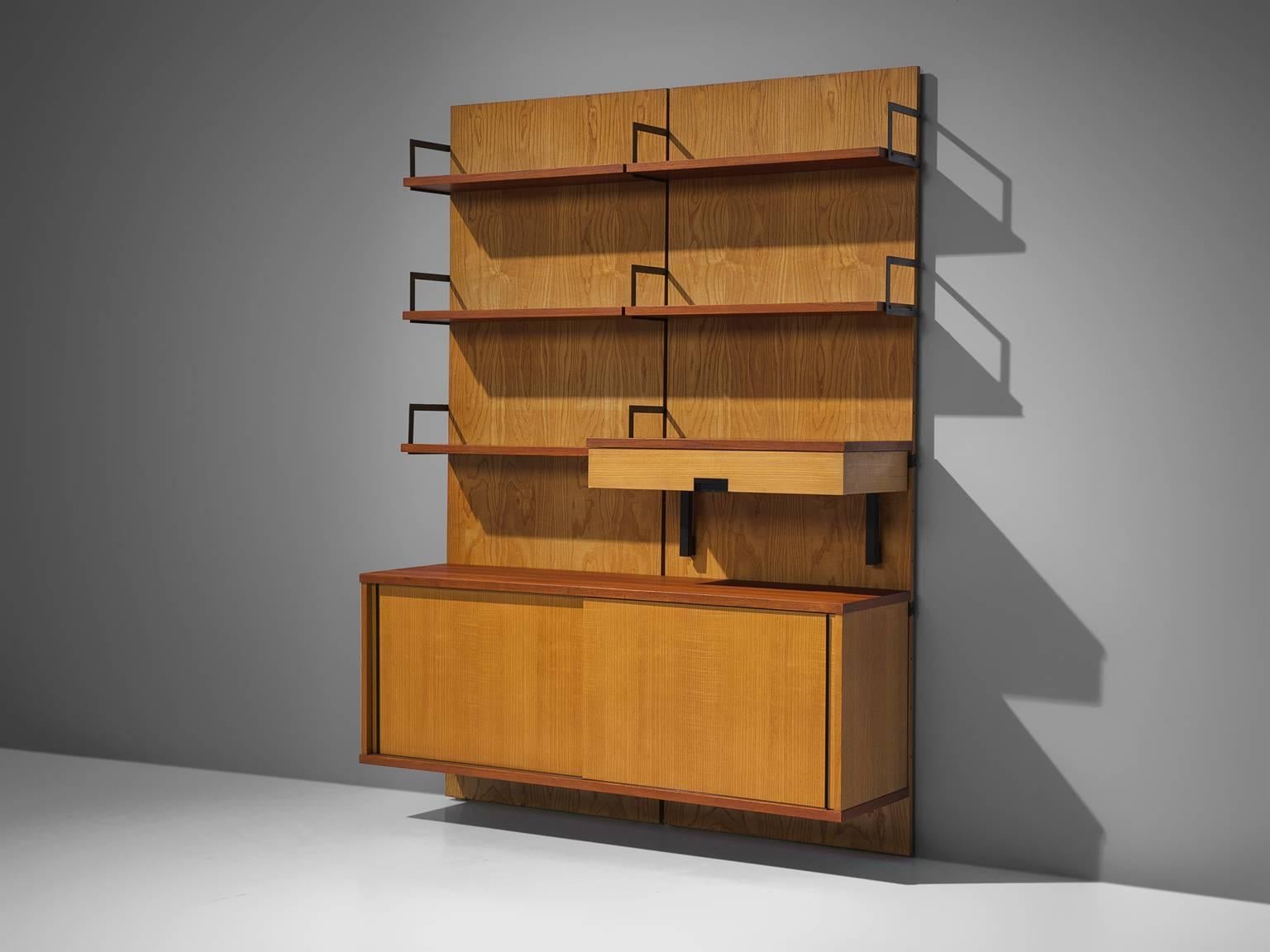 Cees Braakman for UMS Pastoe, modular wall-unit, teak, maple and metal, the Netherlands, 1958. 

This modular wall cabinet is part of the Japanese series of Cees Braakman for Pastoe. The piece is currently divided over two panels, yet these shelves
