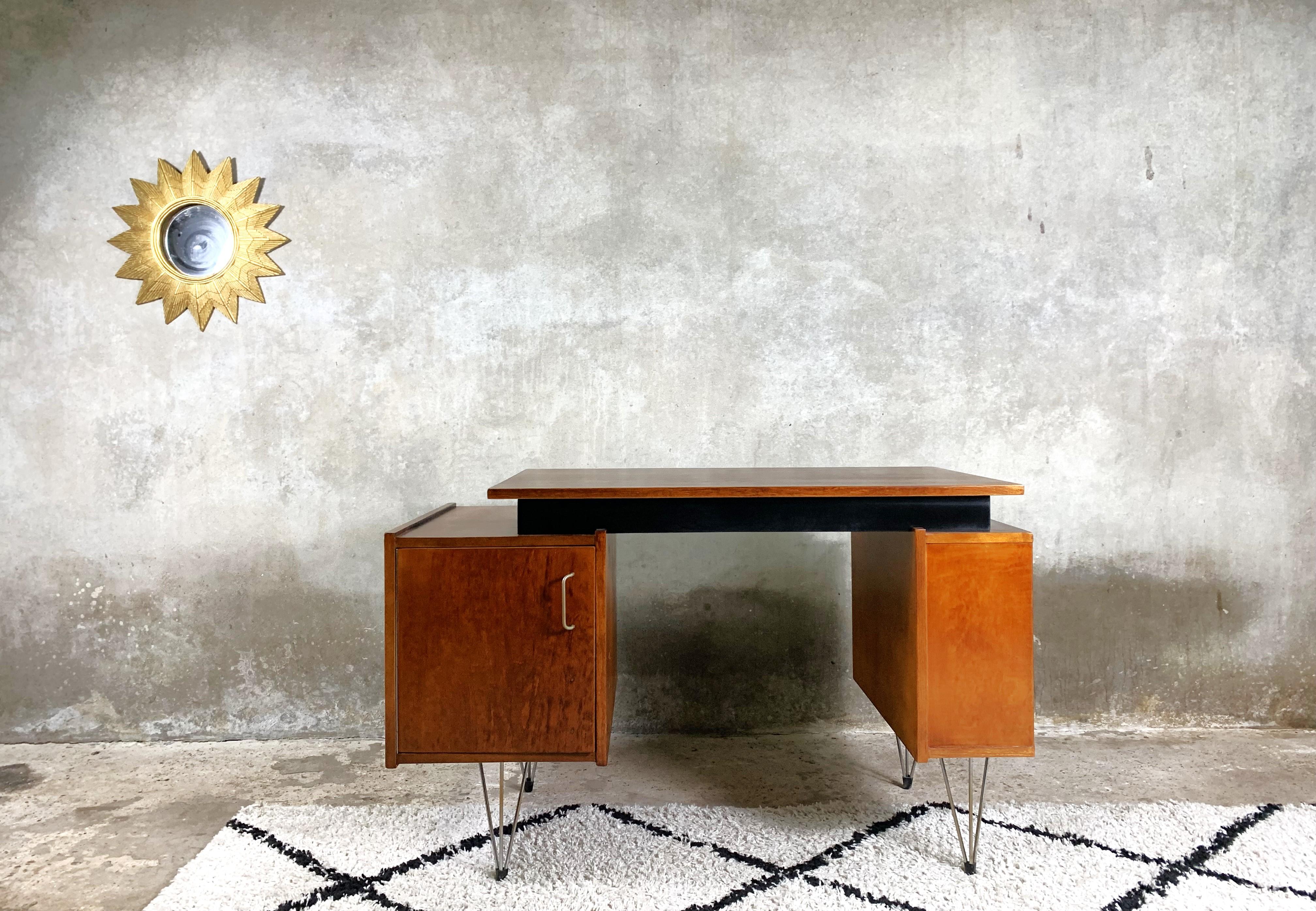 A neat desk designed by Cees Braakman for the Pastoe label. An extremely rare model with two cabinets on metal legs. The desk is veneered, the internal drawers have been renovated. A beautiful example of Dutch mid-century design.