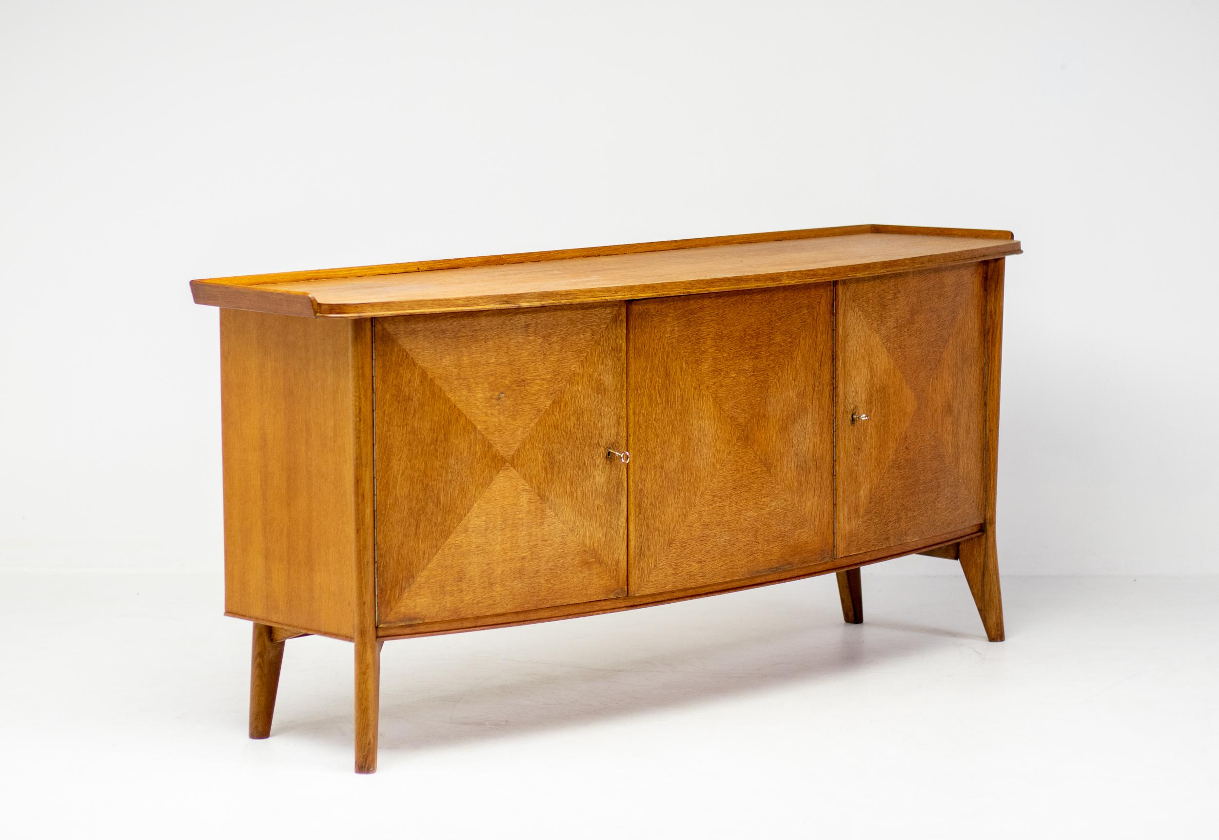 This very rare design by Dutch designer Cees Braakman for Pastoe predates the design of the award-winning design of the “Pointe de Diamant” Sideboard by Antoine Philippon and Jacqueline le Coq by over 10 years. 
One can clearly see where this