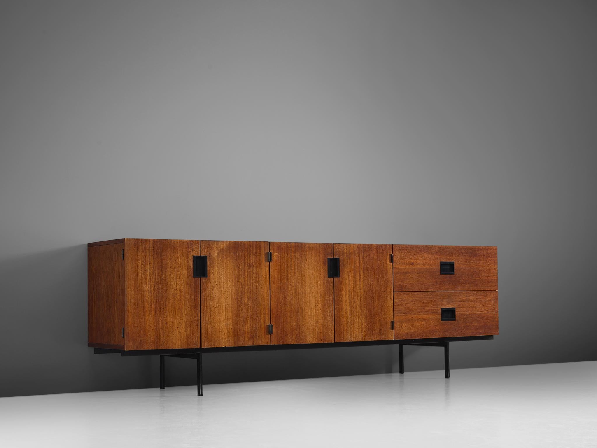 credenza consists of two double doors and two drawers. The warm colored teak nicely combines with the black handles, which are beautifully contrasting with the woode surface.

Cees Braakman (1917-1995) followed his father’s footsteps as the