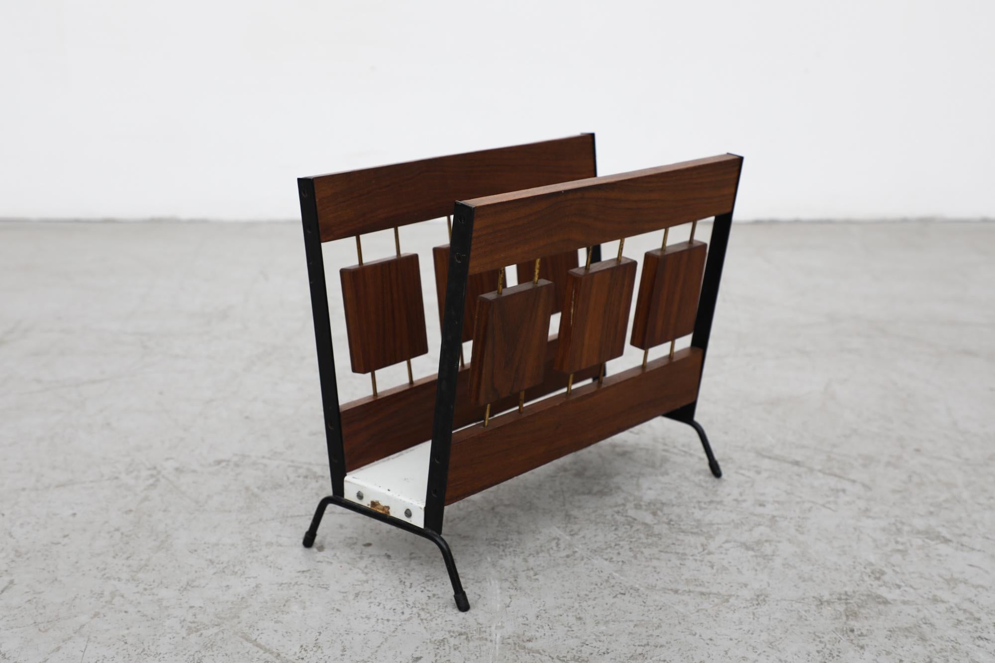 Beautiful, Mid-Century, 1970's wood block magazine rack by Dutch manufacturer Brovorm. Beautifully designed, featuring a black and white enameled metal frame adorned with subtle brass accents. The piece is in original condition with some visible