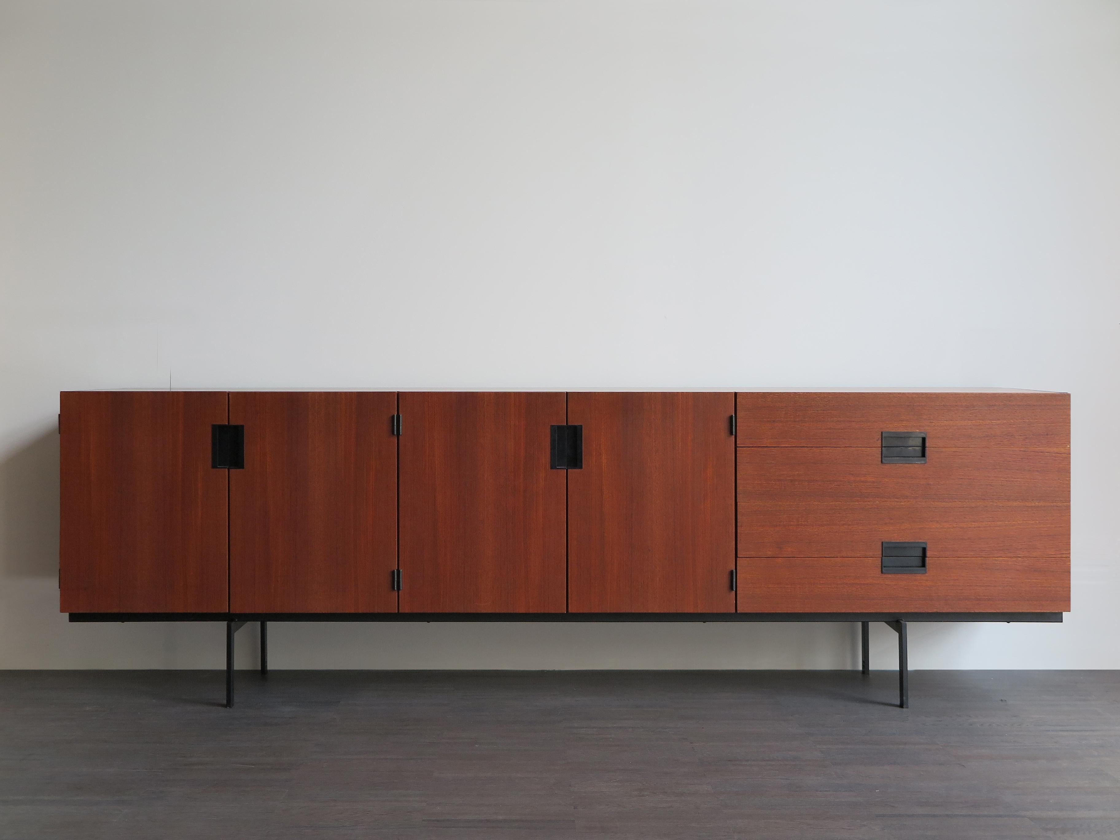 Modern sideboard designed by Cees Braakman and produced by the Dutch company UMS Pastoe in 1955, it was later renamed to the ‘Japanese Series’ because of its sleek form, Minimalist and simplicity.
Covered in teak veneer with black details and a