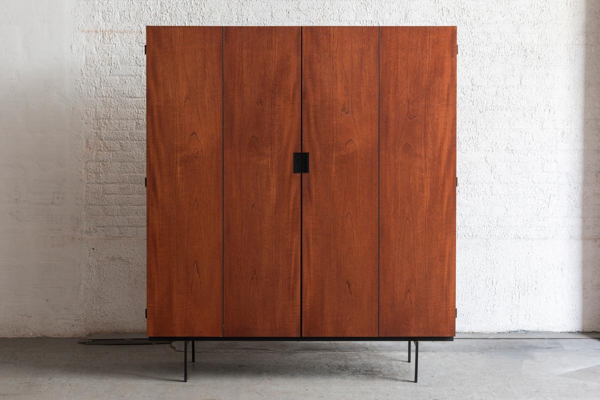 Wardrobe, KU14, from the Japanese series designed by Cees Braakman in 1958 and produced by Pastoe in the Netherlands. Black lacquered steel frame with a teak veneered body. This wardrobe is opened with the typical black plastic handles and accordion