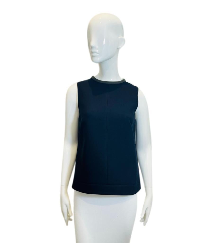 Cefinn Sleeveless Top
Black blouse detailed with olive trimmed crew neckline.
Featuring boxy silhouette and zip fastening to rear.
Size – 10UK
Condition – Very Good
Composition – 65% Polyester, 33% Viscose, 2% Elastane


