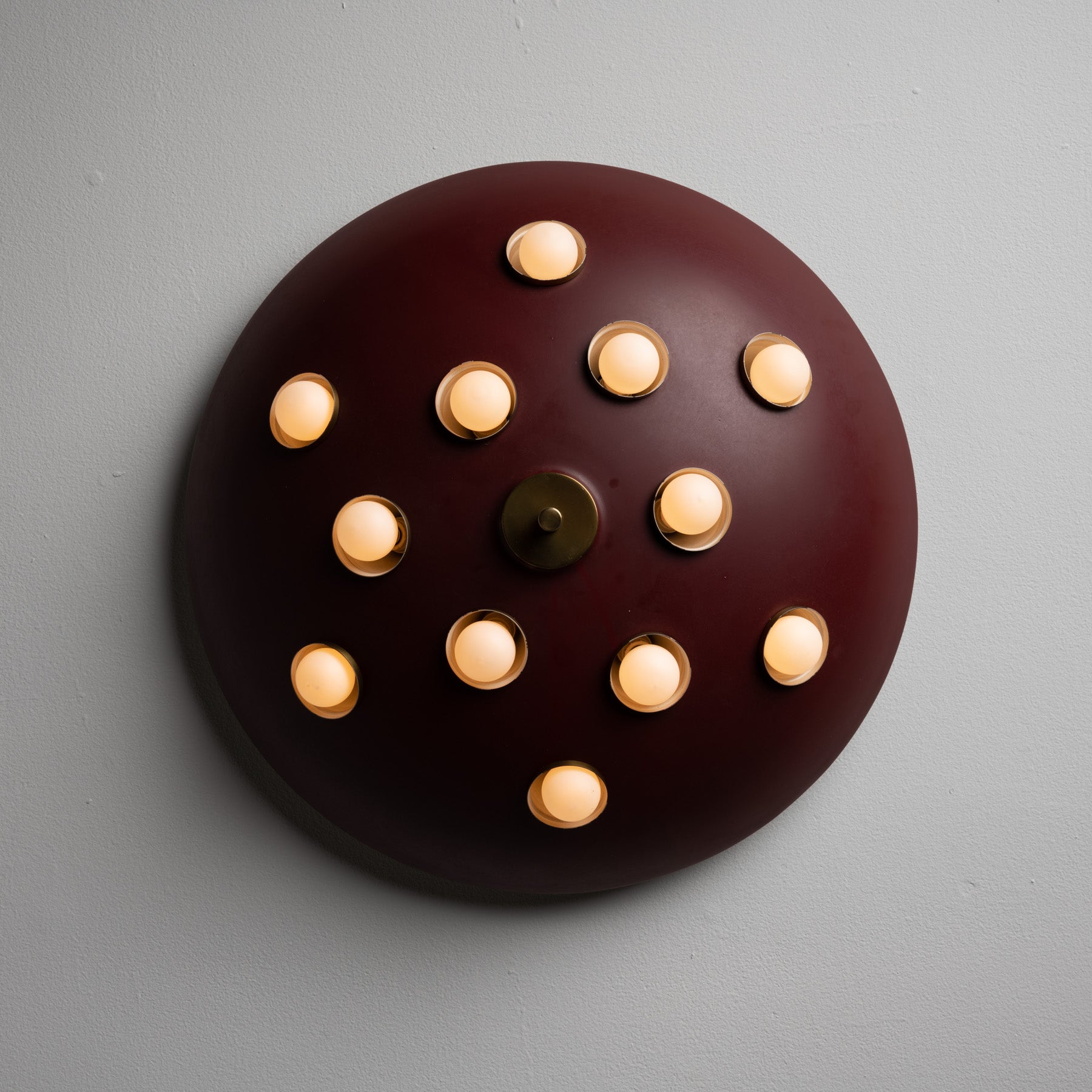 Ceiling Light by Oscar Torlasco for Lumi. Designed and Manufactured in Italy, circa the 1960s. Painted with spotted light sockets throughout the disk. Rewired for US standards. Takes twelve E27 40 watts max bulbs. Bulbs provided as a one time