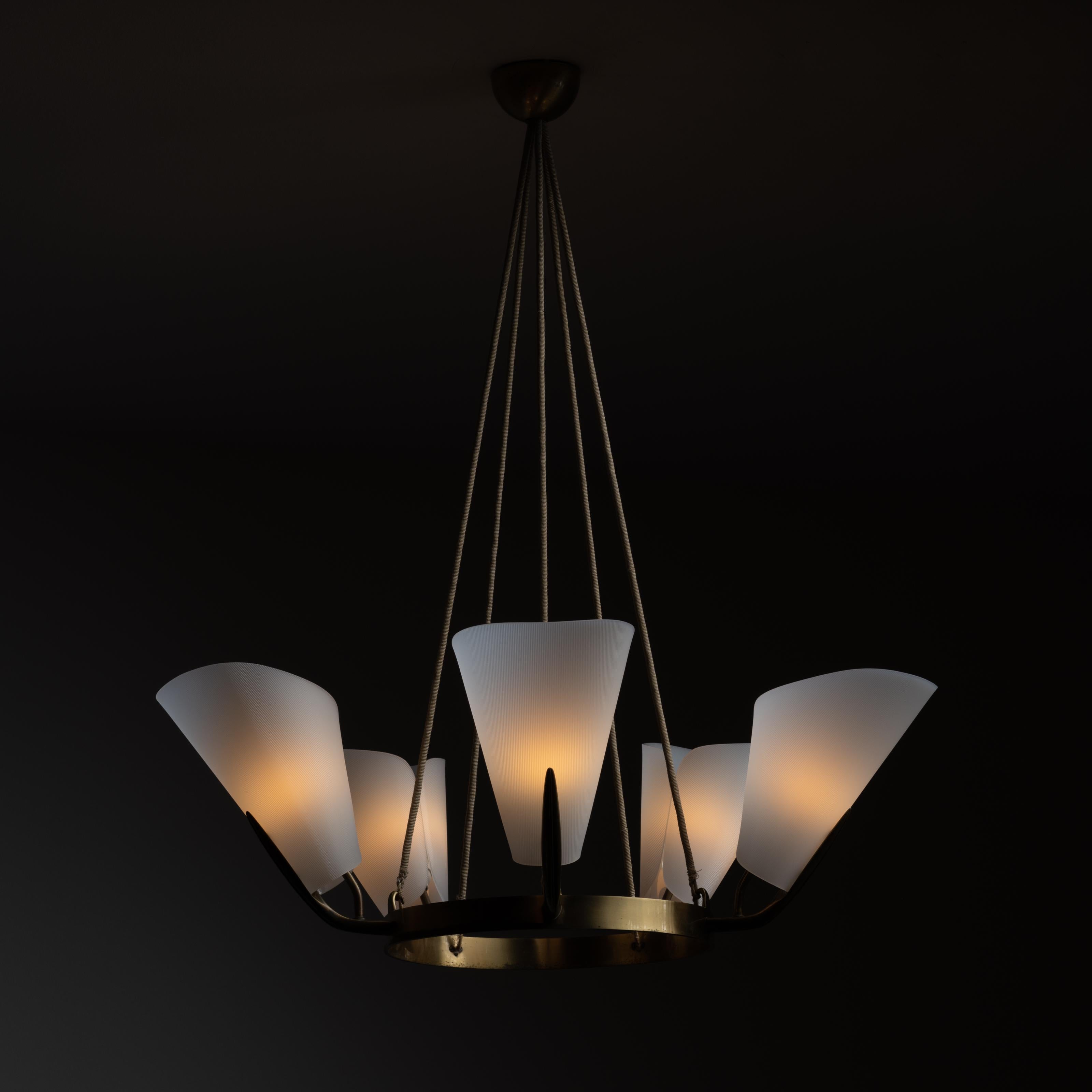 Ceiling Chandelier (Attributed to Stilnovo). Designed and manufactured in Italy, circa the 1950s. Textured acrylic tulip shades fall in form around an aged solid brass wheel. Thick beige rope suspension cords are used to hoist this striking piece.