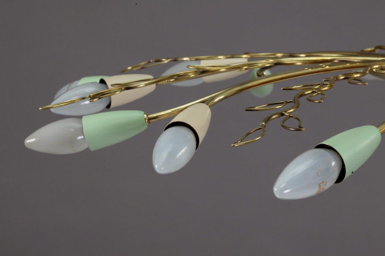 Ceiling flush mount,
Rupert Nikoll,
Vienna, 1950.
Brass, eight arms with colored cones,
16 bulbs.