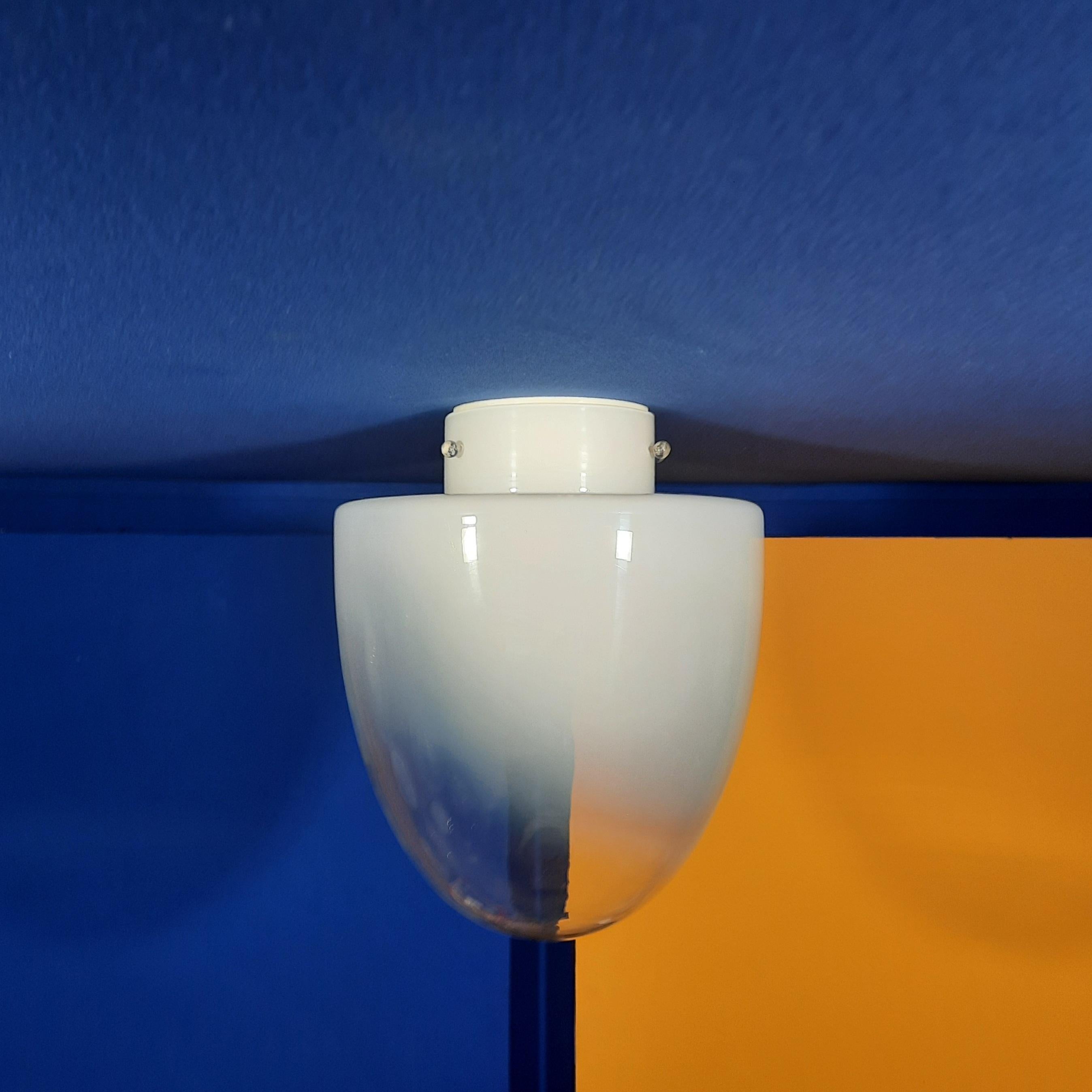 Ebe model is a flush mounted for wall and ceiling and was edited by Leucos and designed by Guisto Toso in 1972. It was declined in table lamps and flush mount wall or ceiling lights and suspensions. It is made in a gradient white 
