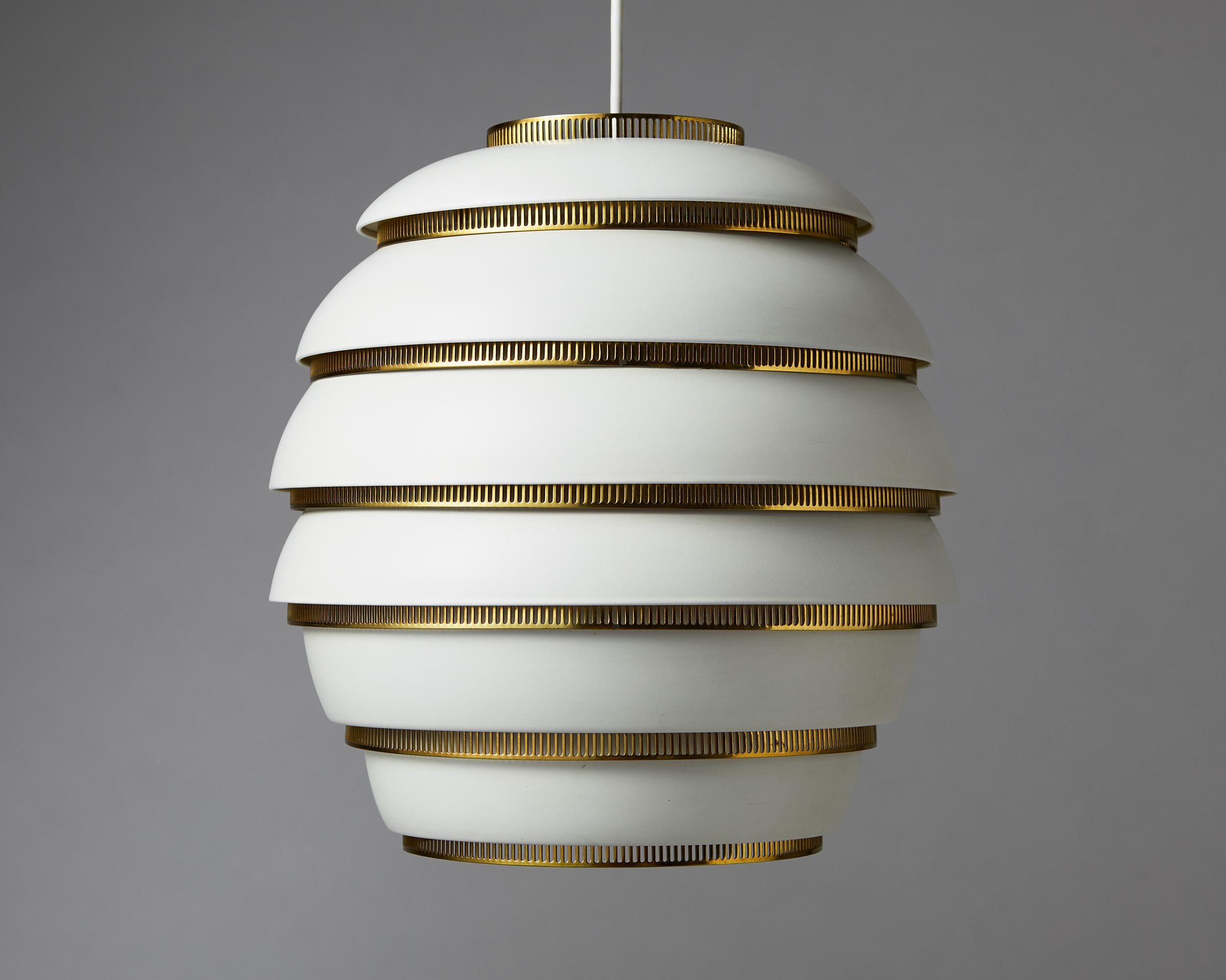 Ceiling lamp model A332 “Beehive” designed by Alvar Aalto for Valaistustyo,
Finland, 1953.

Painted aluminium and polished brass.

Early six tier version.

Stamped, 'VAlAISTUSTYO A33 A'

The A331, nicknamed “Beehive,” is one of Alvar Aalto’s most