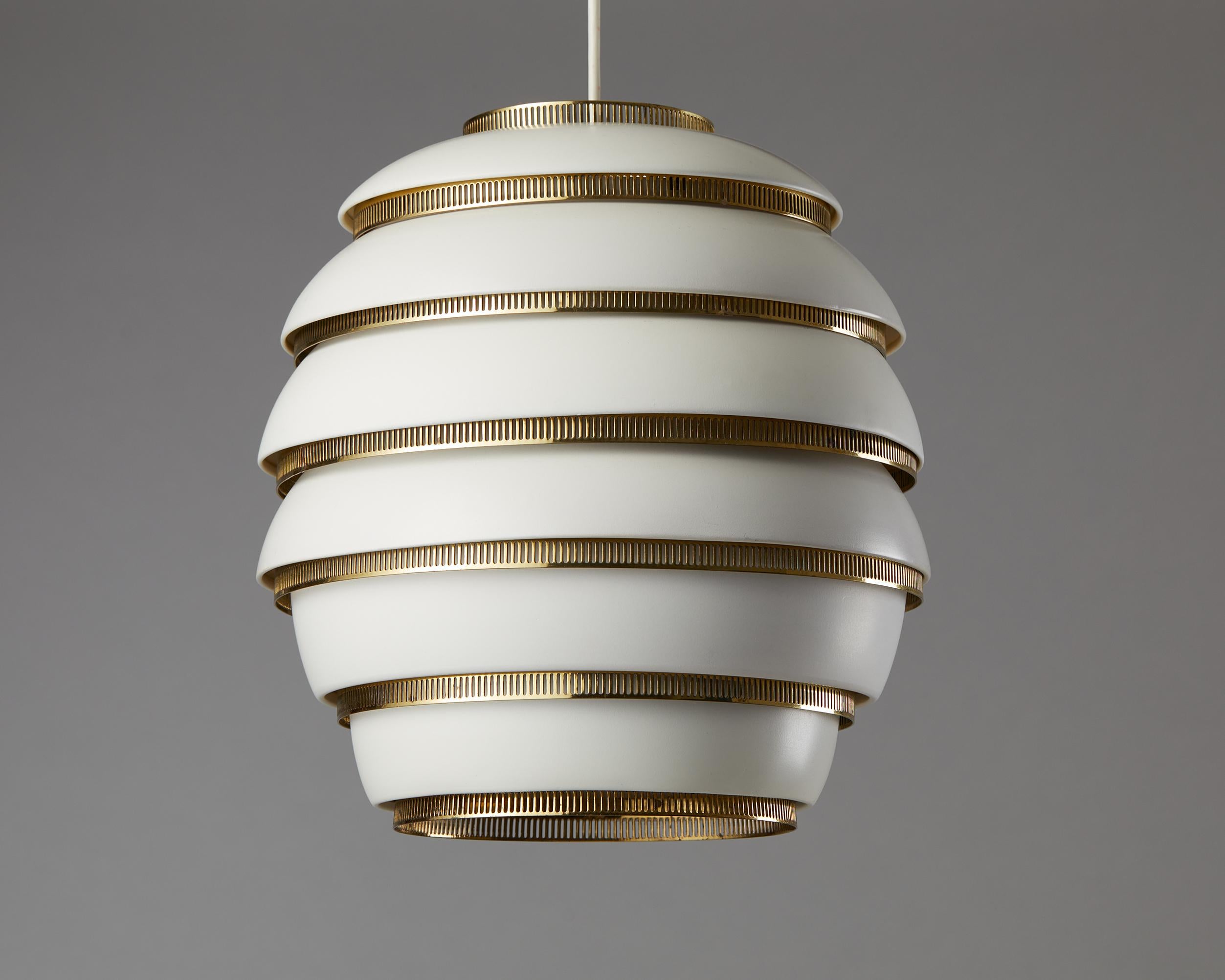 Ceiling lamp ‘Beehive’ model A332 designed by Alvar Aalto for Valaistustyo,
Finland. 1953.

Painted aluminium and polished brass.

Early six tier version.

Engraved ‘A332 Valaistustyo’.

Measures: 
Height: 36 cm / 1' 2