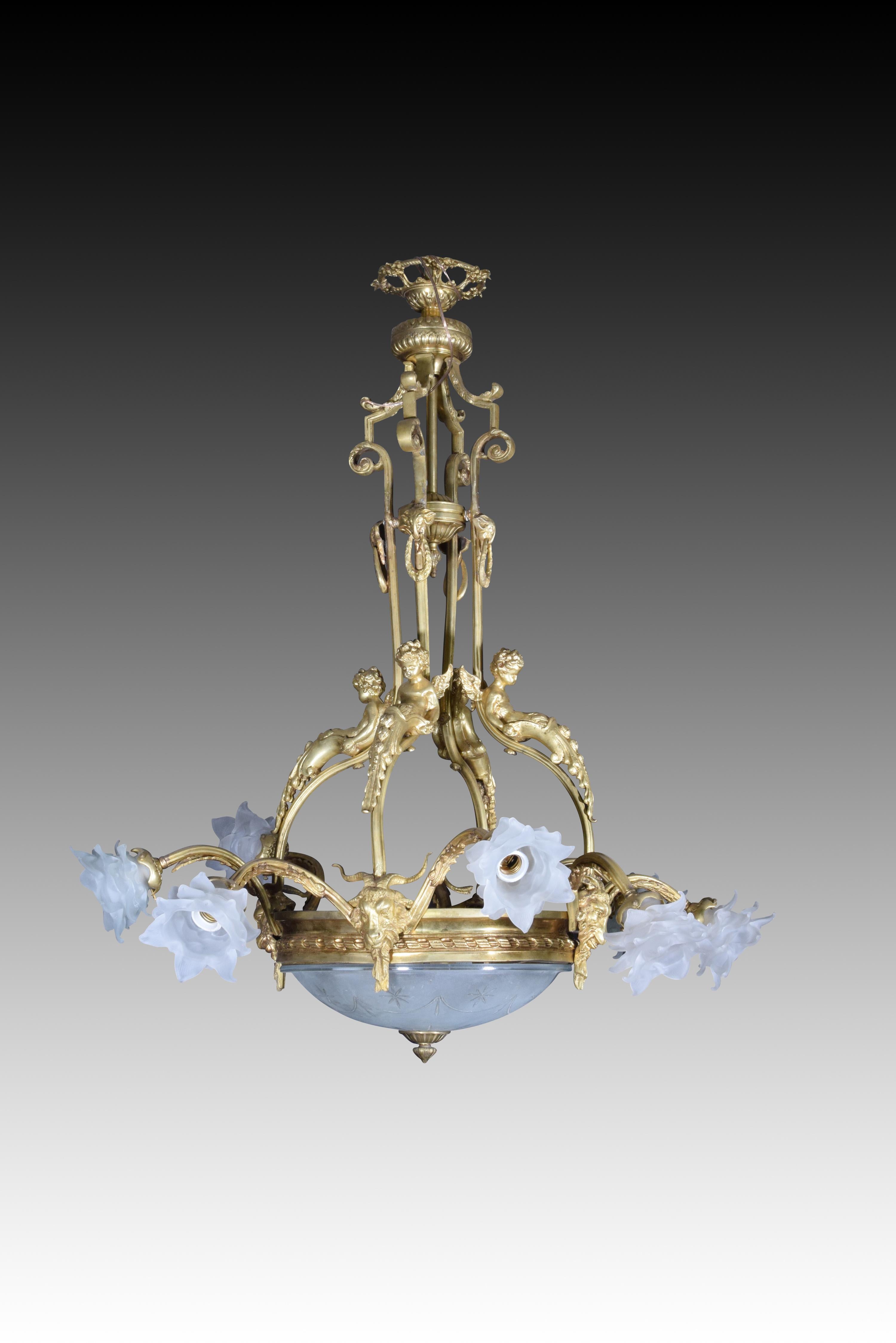 Lamp. Bronze, glass.
 Classical style ceiling lamp that has a central glass ceiling edged in bronze and with ram heads, from which two arms emerge ending in glass tulips in the shape of a flower. The connection to the ceiling is made using bronze