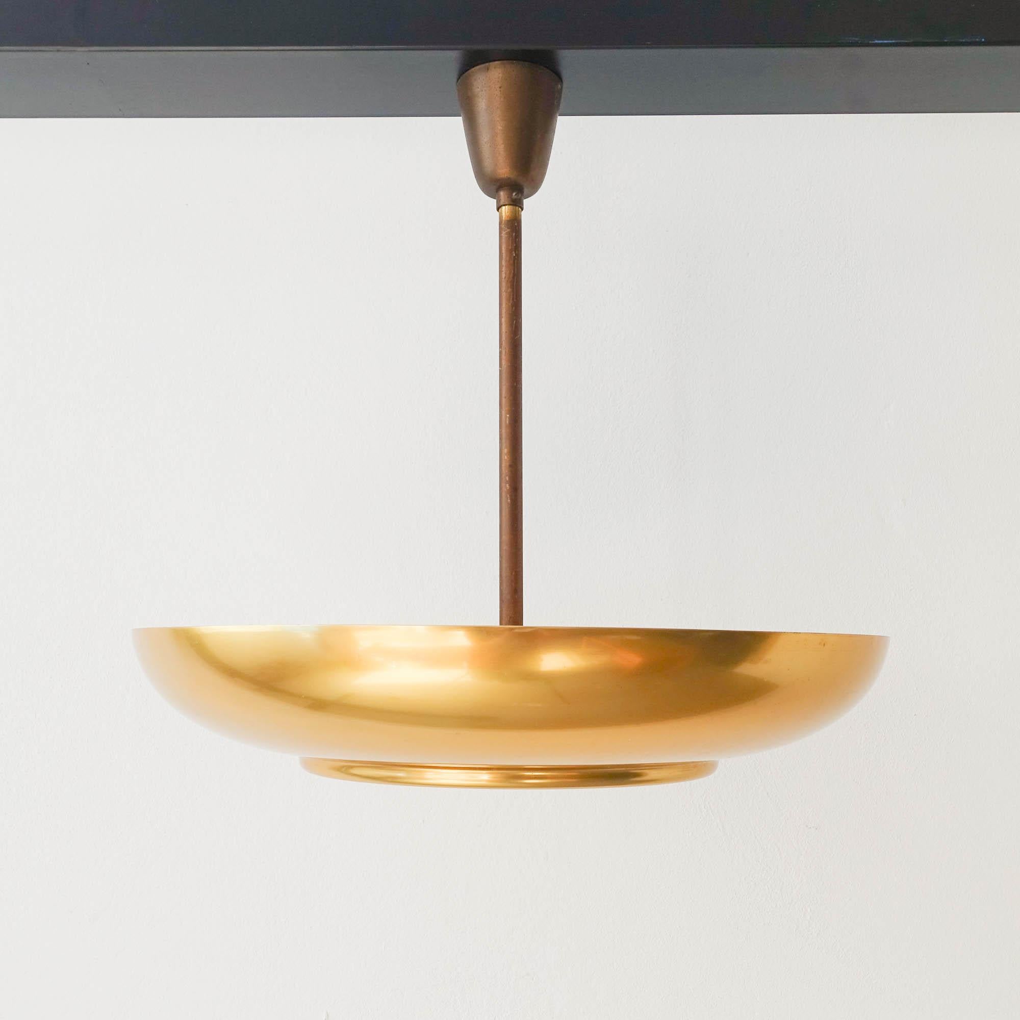 A very rare large and impressive ceiling light designed by Christian Dell for Kaiser Idell. The lamp is made of brass and etched bevelled glass. Painted off-white internally. The light can be projected on the ceiling and because of the glass it also