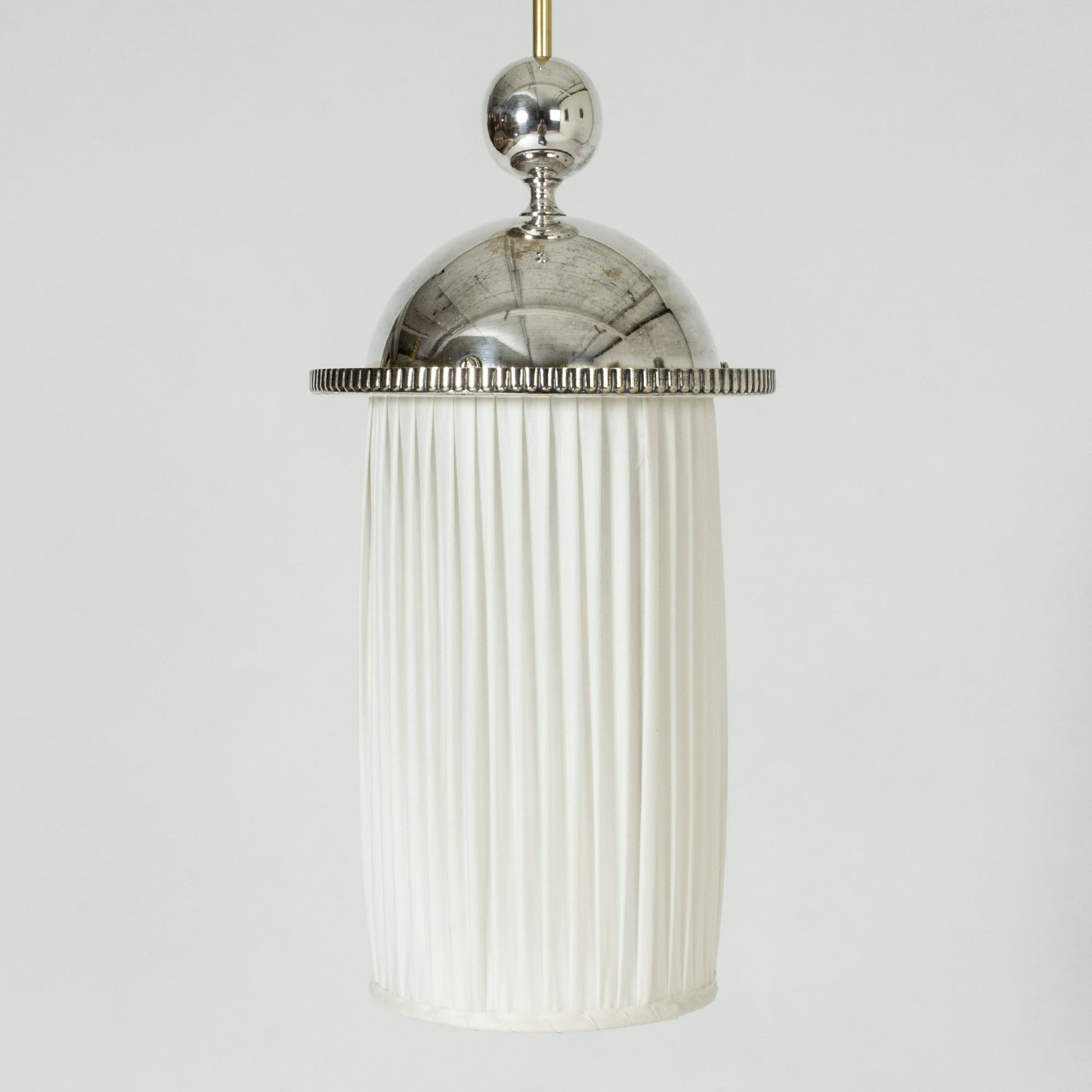 Very elegant ceiling lamp by Elis Bergh, made from white metal and upholstered with white fabric. Cylinder form with a decorative pattern around the dome shaped top.