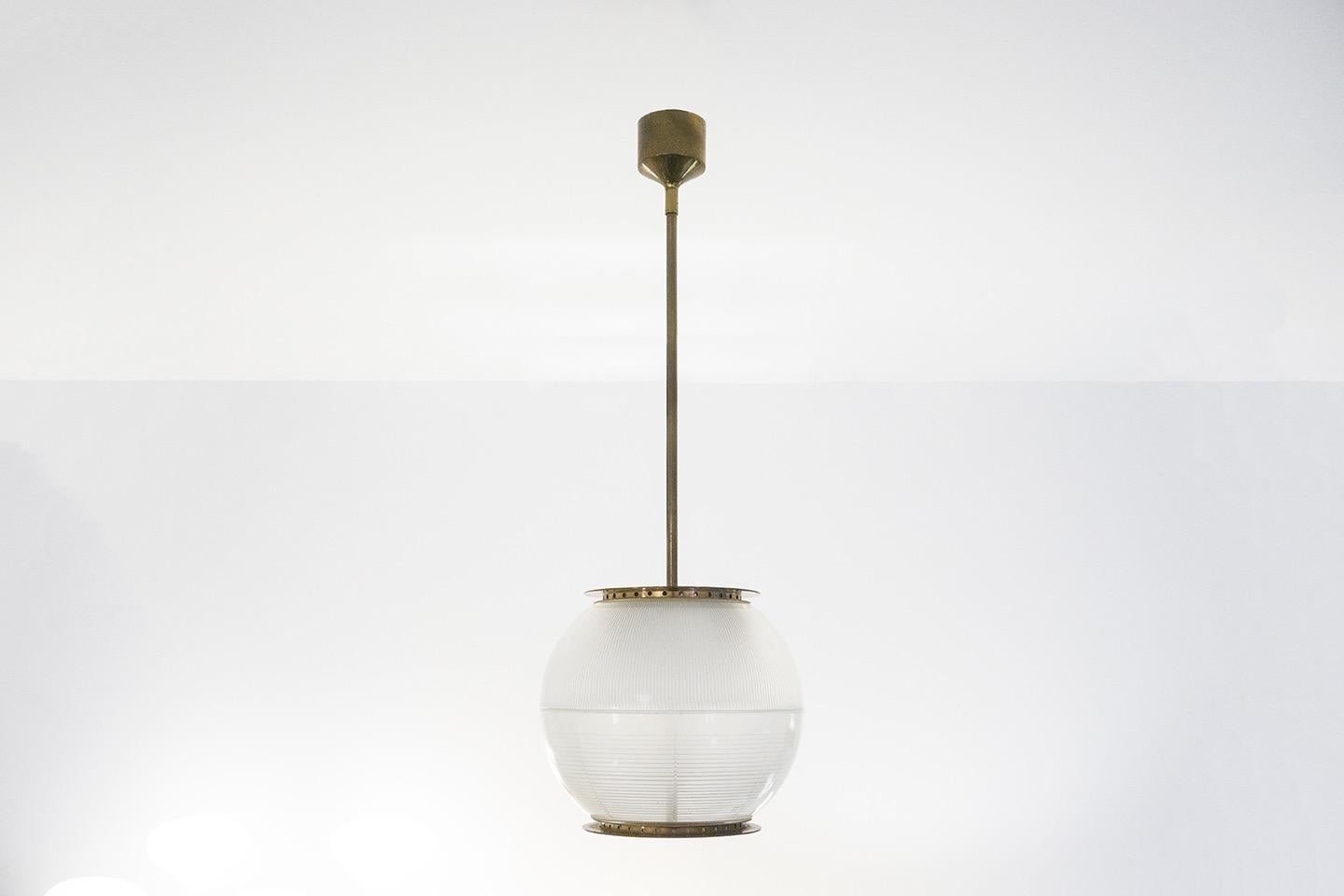 Ceiling lamp, model 'LP8'
Brass construction and pressed glass in two pieces
Dimensions / H.100 ø26cm
Design / Ignazio Gardella 1950
Manufacturer / Azucena

2 pieces available.