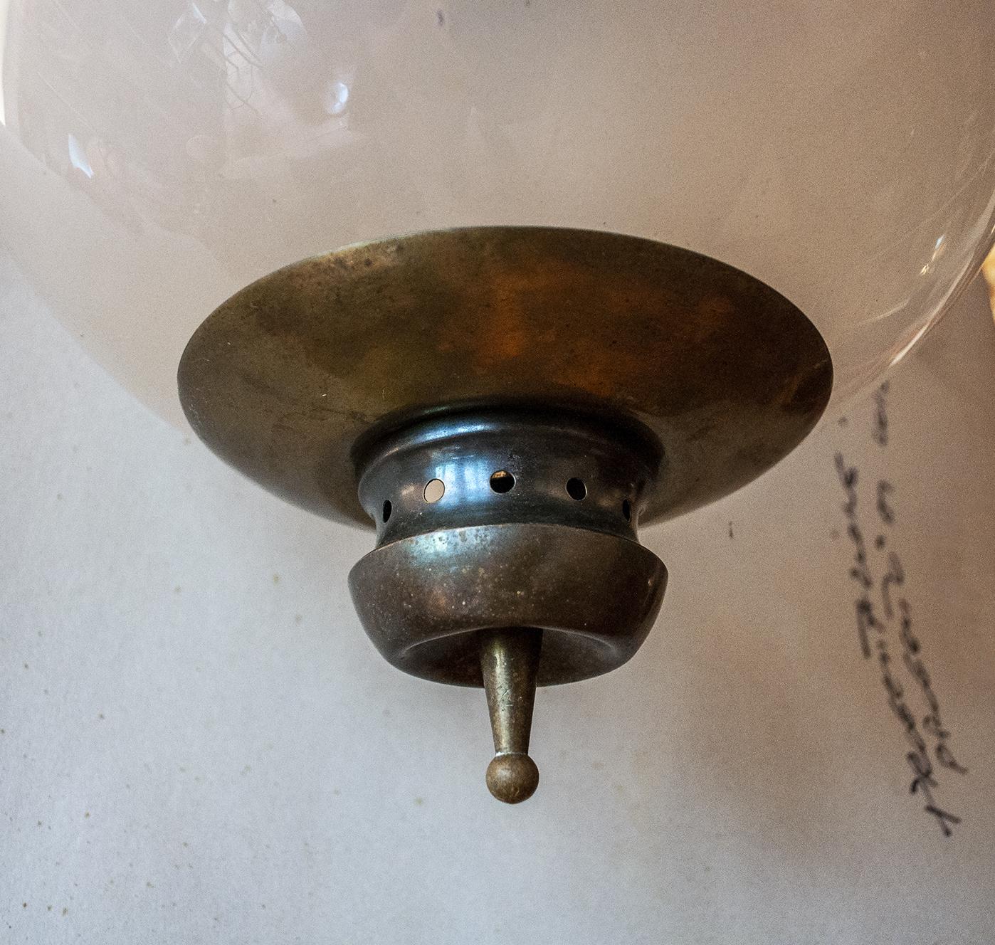 Ceiling lamp in glass and brass with iron chain.
Designer Luigi Caccia Dominioni
Producer Azucena,
1950s.