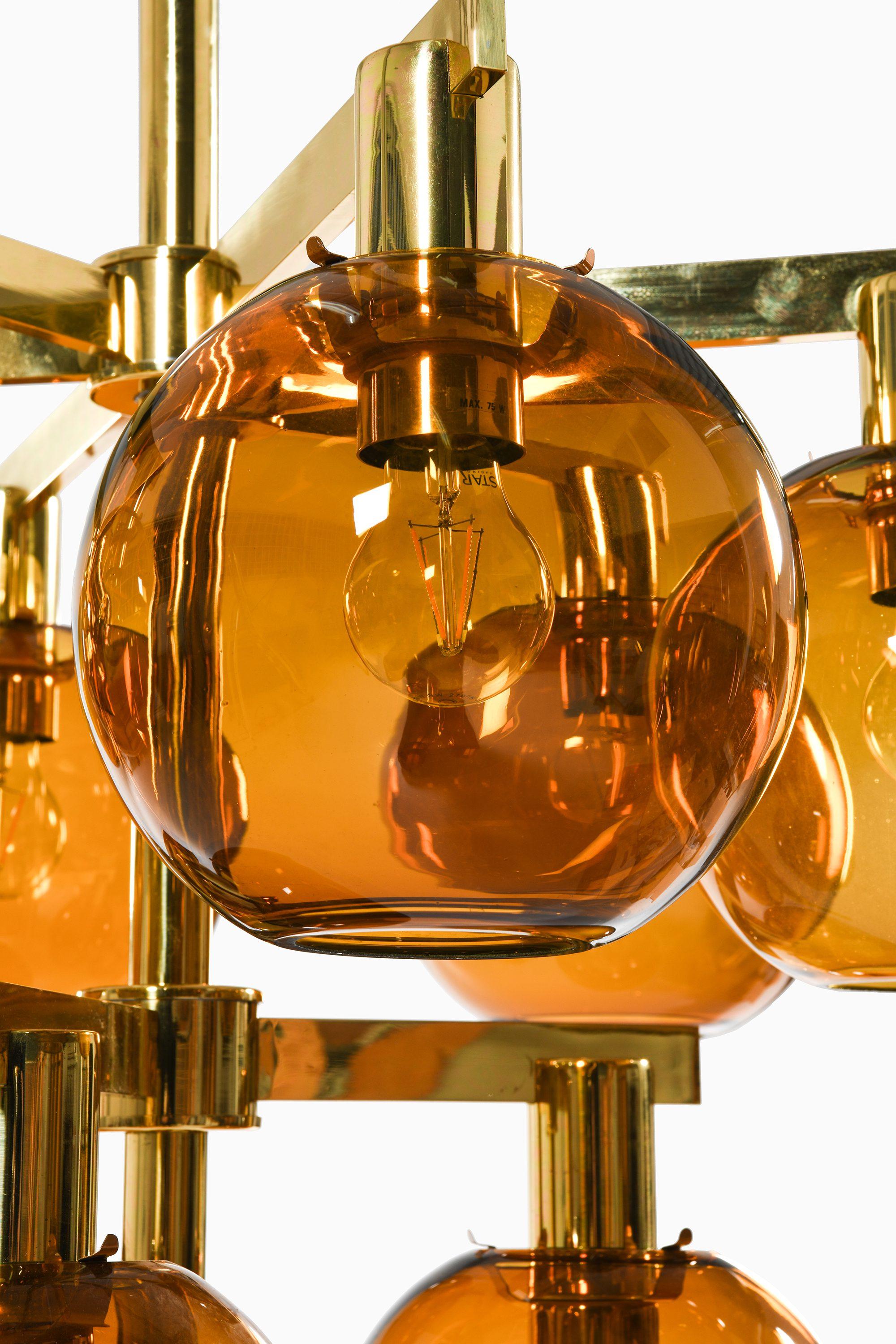 Swedish Ceiling Lamp Chandelier in Brass and Amber Glass by Hans-Agne Jakobsson, 1950's For Sale