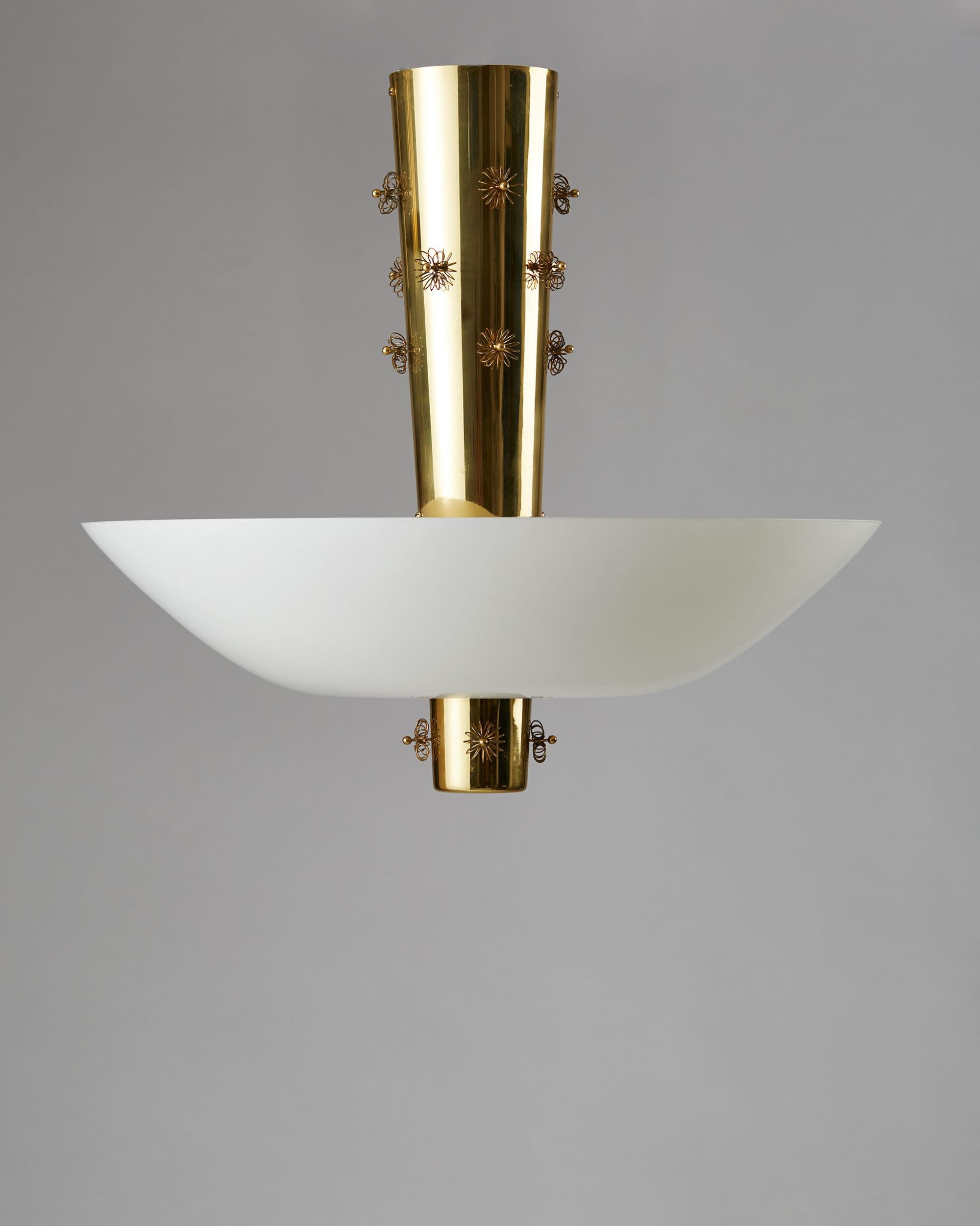 Ceiling lamp designed by Paavo Tynell for Taito Oy, Finland, 1950s.
Brass and opaline glass.

Measures: 
H 57.5 cm/ 1' 11