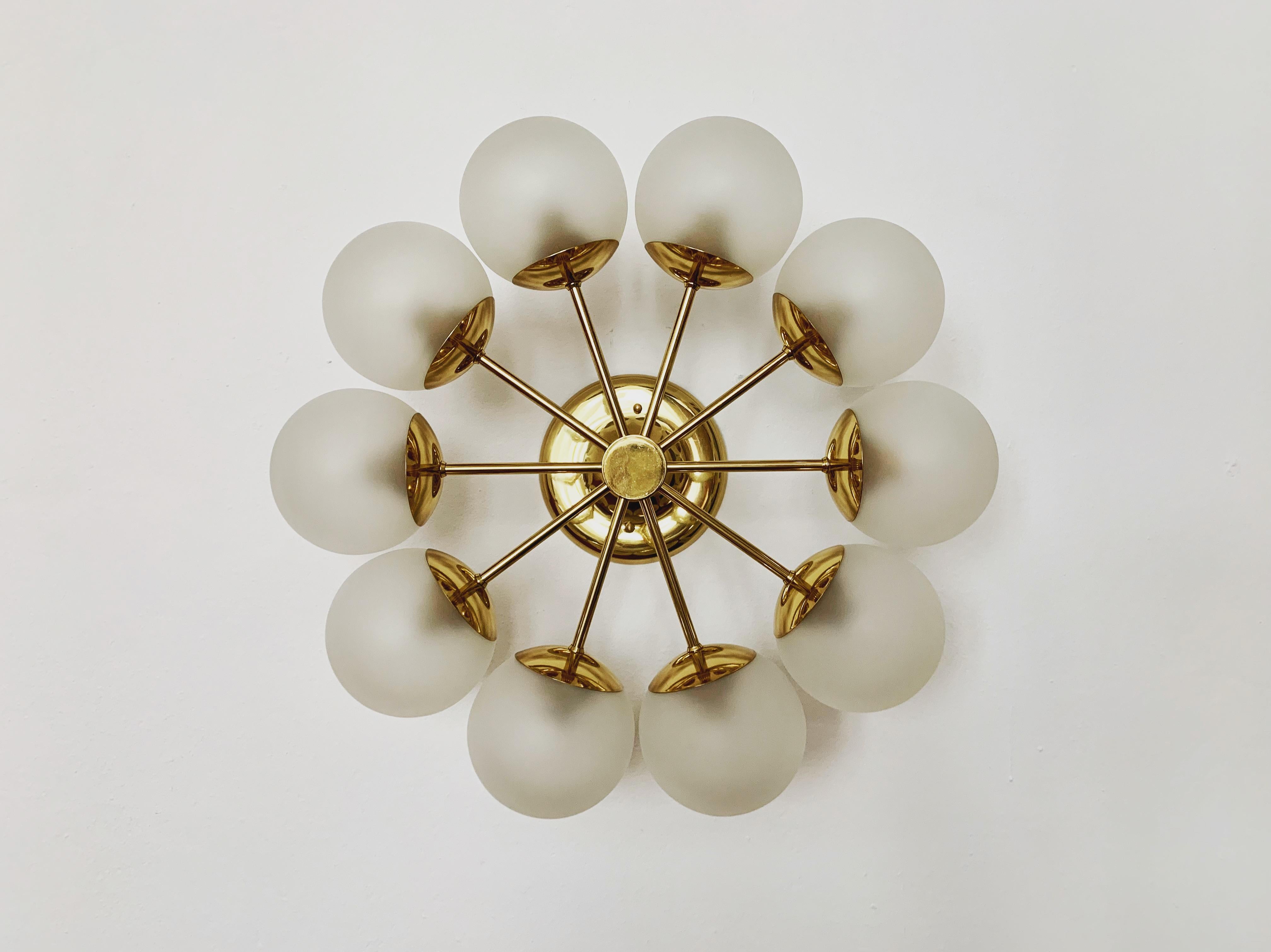 Extremely beautiful and large German Sputnik chandelier from the 1960s.
The 10 etched lampshades spread a pleasant light.
The lamp has a very high quality finish.
Very contemporary design with a fantastic noble appearance.

Manufacturer: Kaiser