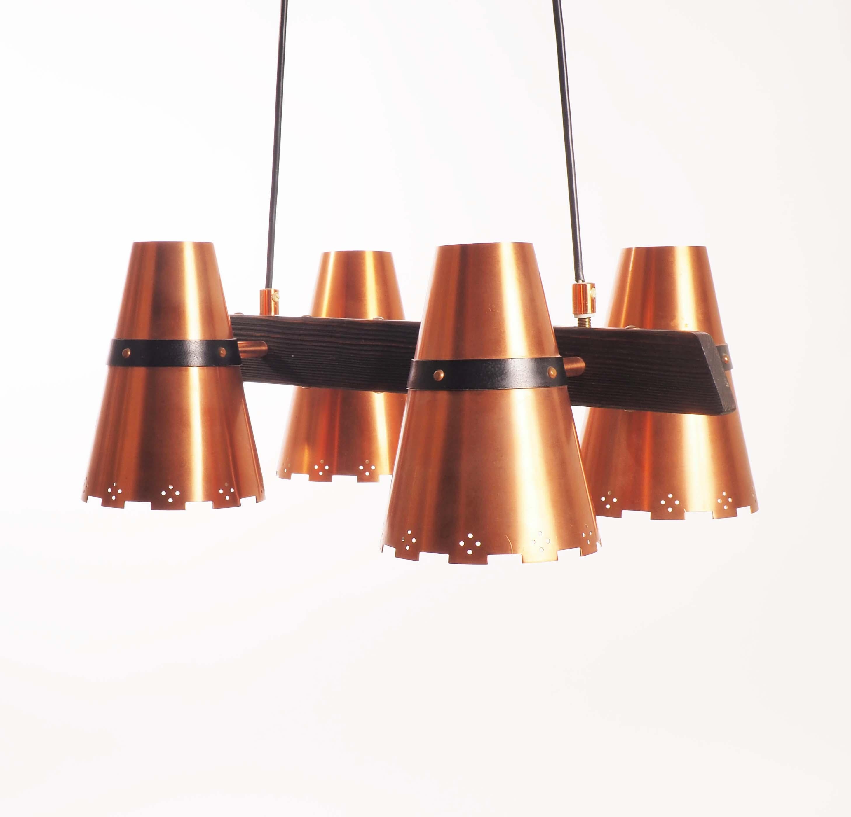 Ceiling lamp in copper and dark wood, made in Sweden during 1960s.