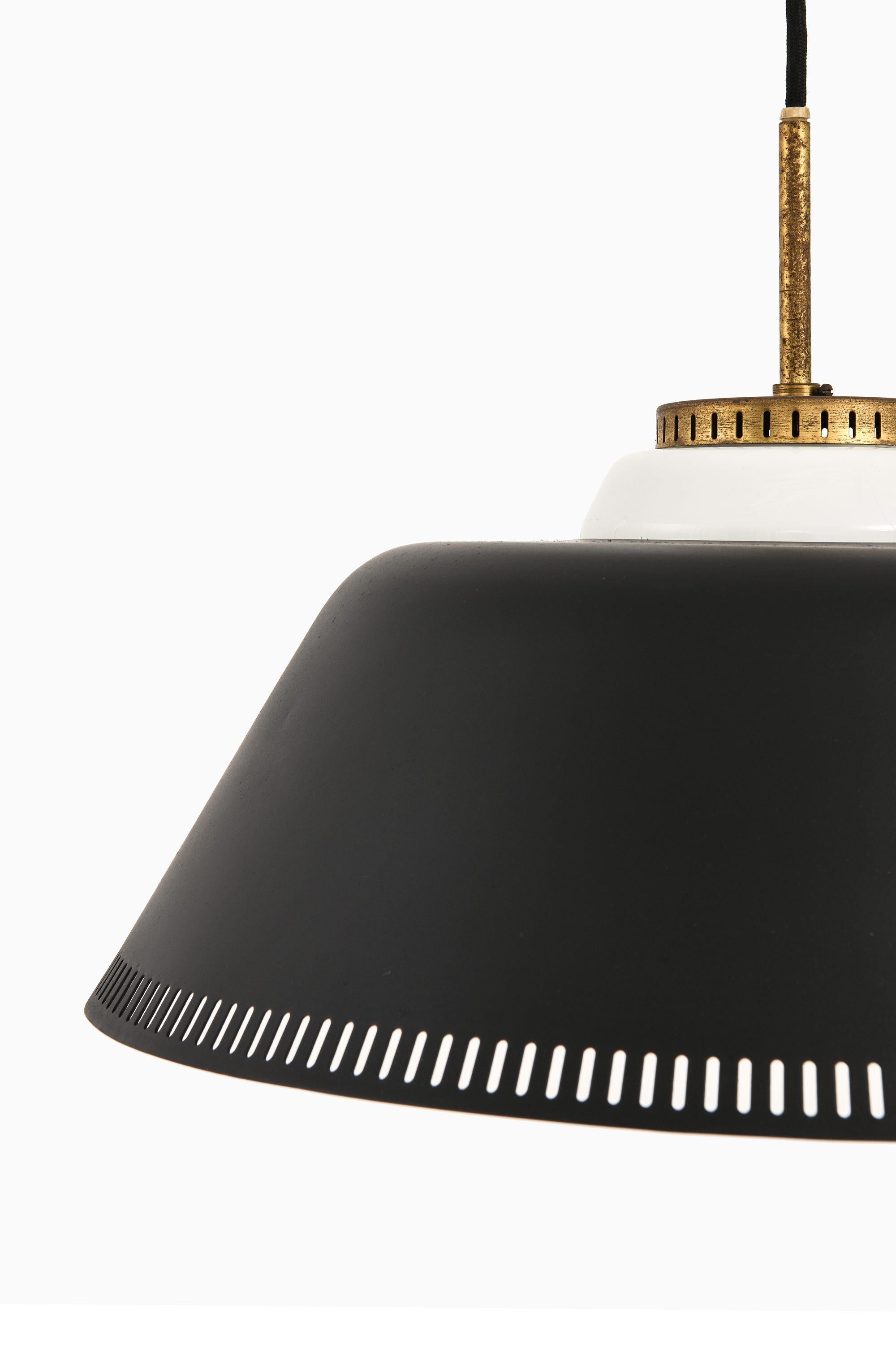 Ceiling Lamp in Brass, Black Lacquered Metal and Opaline Glass by Bent Karlby, 1950’s

Additional Information:
Material: Brass, black lacquered metal and opaline glass
Style: Mid century, Scandinavian
Produced by Lyfa in Denmark
Dimensions (W x D x