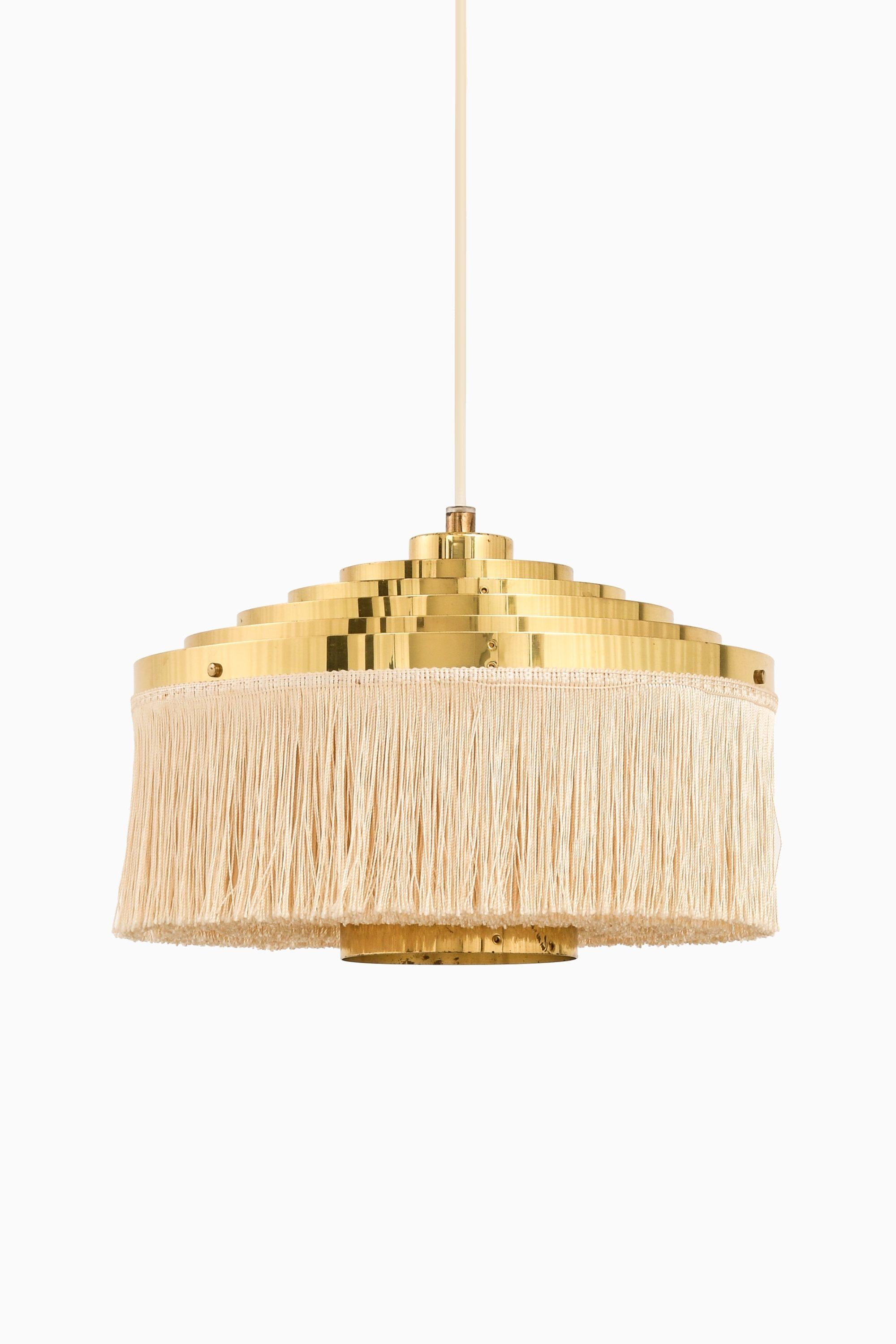 Ceiling Lamp in Brass and Silk Fringes by Hans-Agne Jakobsson, 1950's

Additional Information:
Material: Brass and silk fringes
Style: Mid century, Scandinavian
Produced by Hans-Agne Jakobsson AB in Markaryd, Sweden
Dimensions (W x D x H): 29 x 29 x