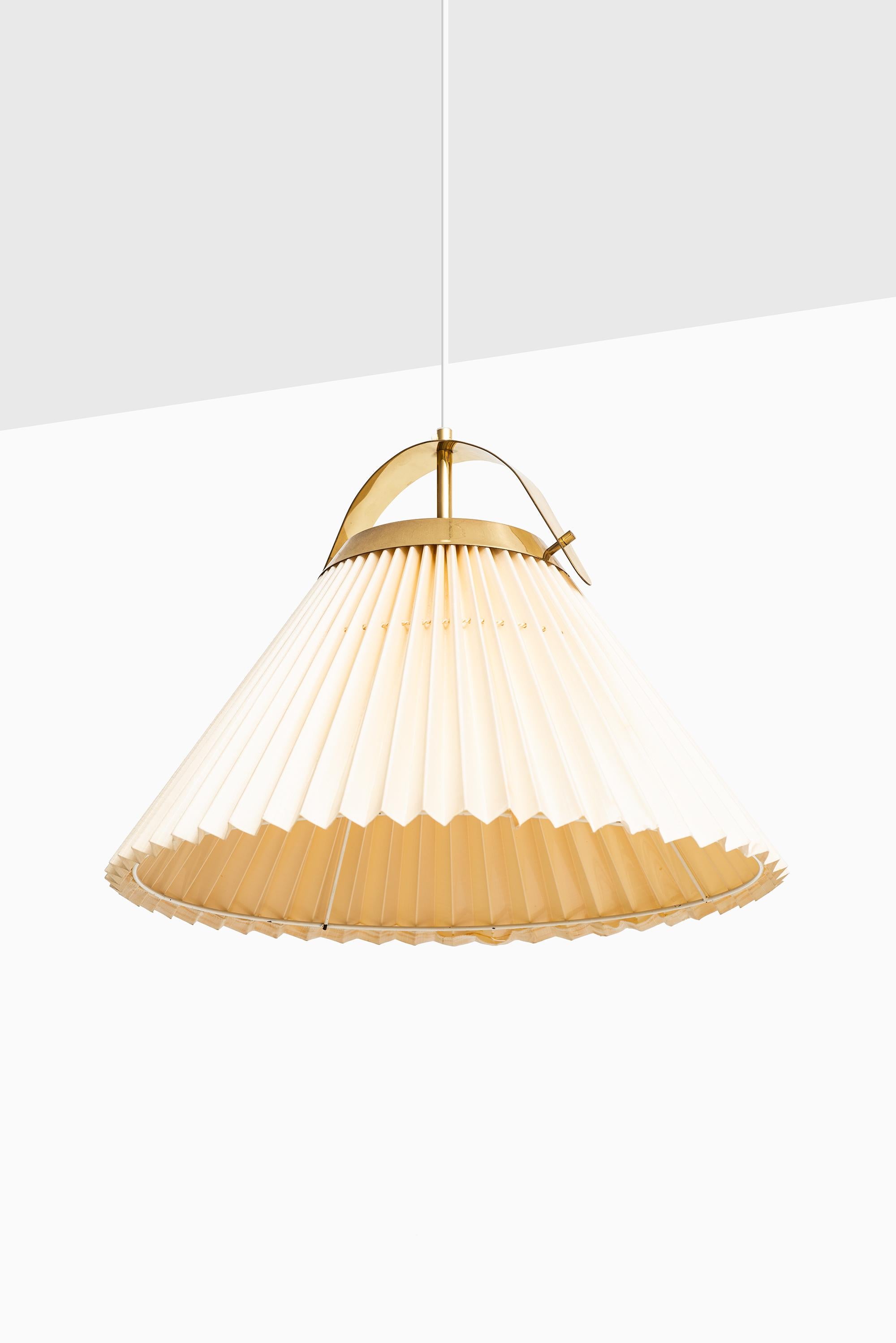 Rare ceiling lamp in brass and original shade. Produced by Bergbom in Sweden.