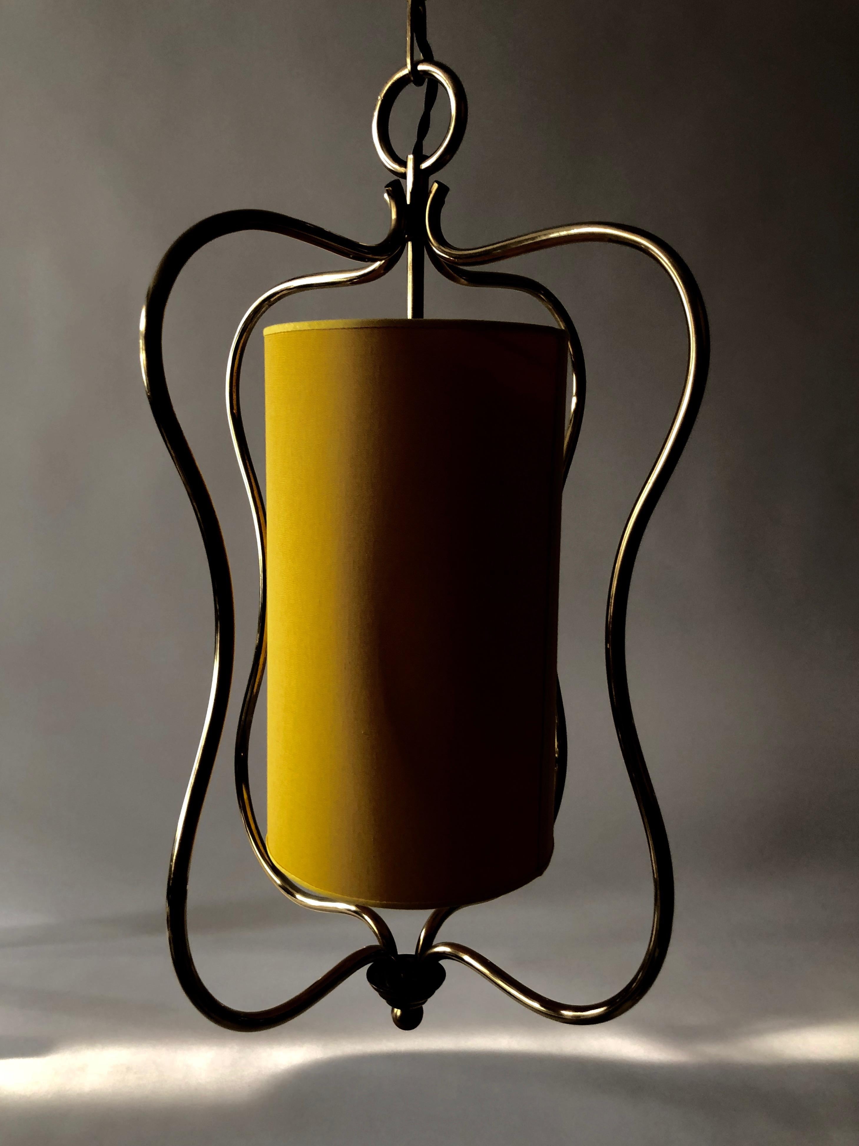 Graceful ceiling lamp made in brass with a new shade in yellow linen.
Produced for the Austrian company Rupert Nikoll in the 1950s.
The lamp has bin rewired.