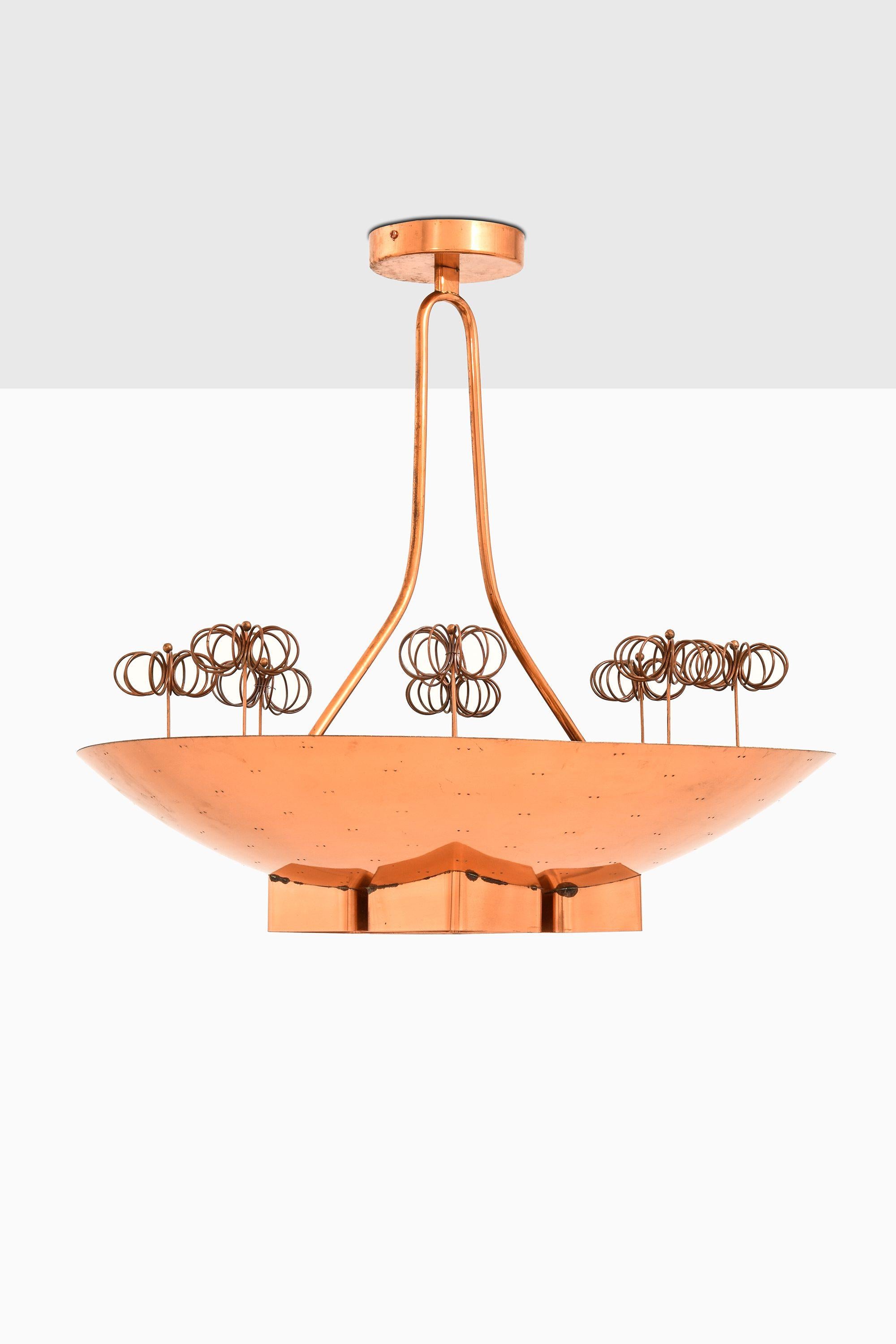 Custom Ordered Ceiling Lamp in Copper & Brass by Paavo Tynell, 1940's

Additional Information:
Material: Copper and brass
Style: Mid century, Scandinavian
Produced by Taito Oy in Finland
Dimensions (W x D x H): 60 x 60 x 60 cm
Condition: Good
