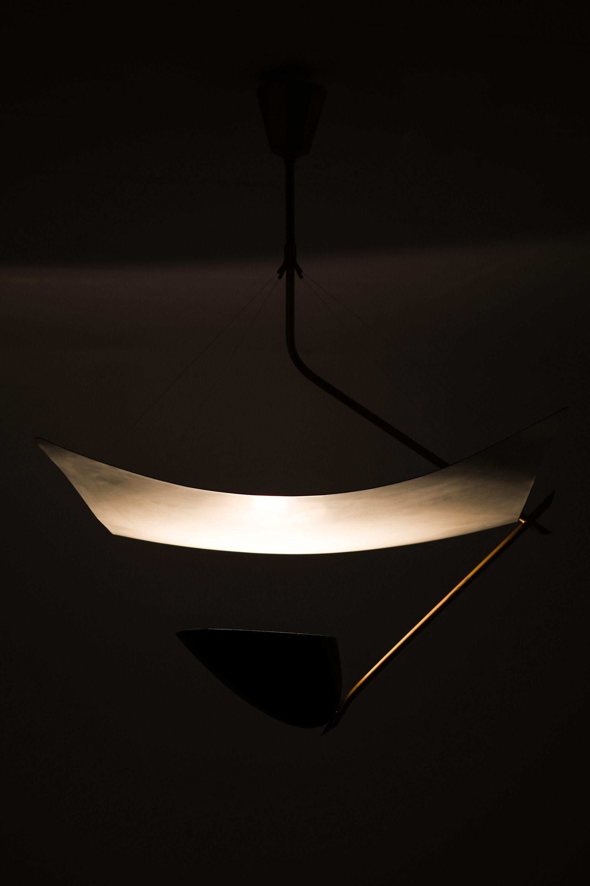 Ceiling Lamp in Lacquered Metal, Nylon Threads and Brass by Angelo Lelii, 1950's

Additional Information:
Material: Lacquered metal, nylon threads and brass
Style: Mid century
Very rare ceiling lamp model Vela
Produced by Bergboms on license in