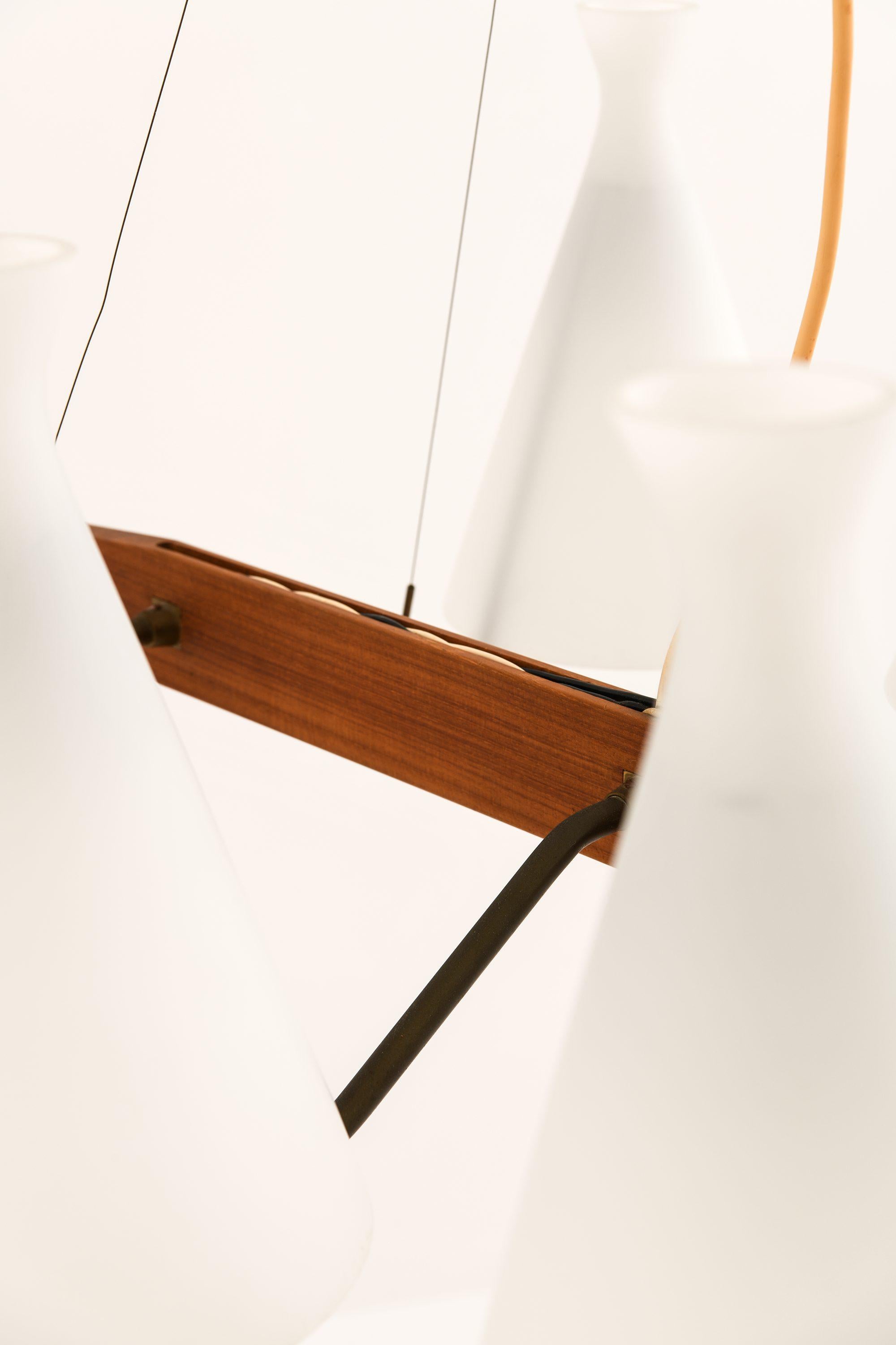 Ceiling Lamp in Teak, Brass & Opaline Glass by Svend Aage Holm Sørensen, 1950's

Additional Information:
Material: Teak, brass and opaline glass
Style: Mid century, Scandinavian
Produced by ASEA in Sweden
Dimensions (W x D x H): 78 x 57 x 78 cm