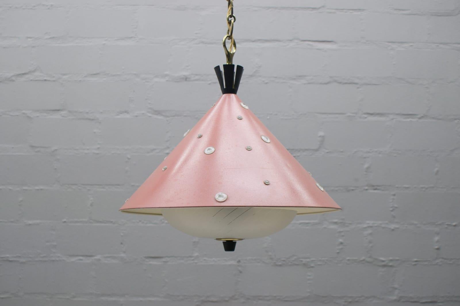 Midcentury hanging lamp. In the manner of Arredoluce / Angelo Lelli.

Rare and elegant midcentury hanging lamp, 1950s, Italy.

The lamp is executed in partly salmon lacquered metal and glass brass and this lamp need 2 x E27 Edison screw fit