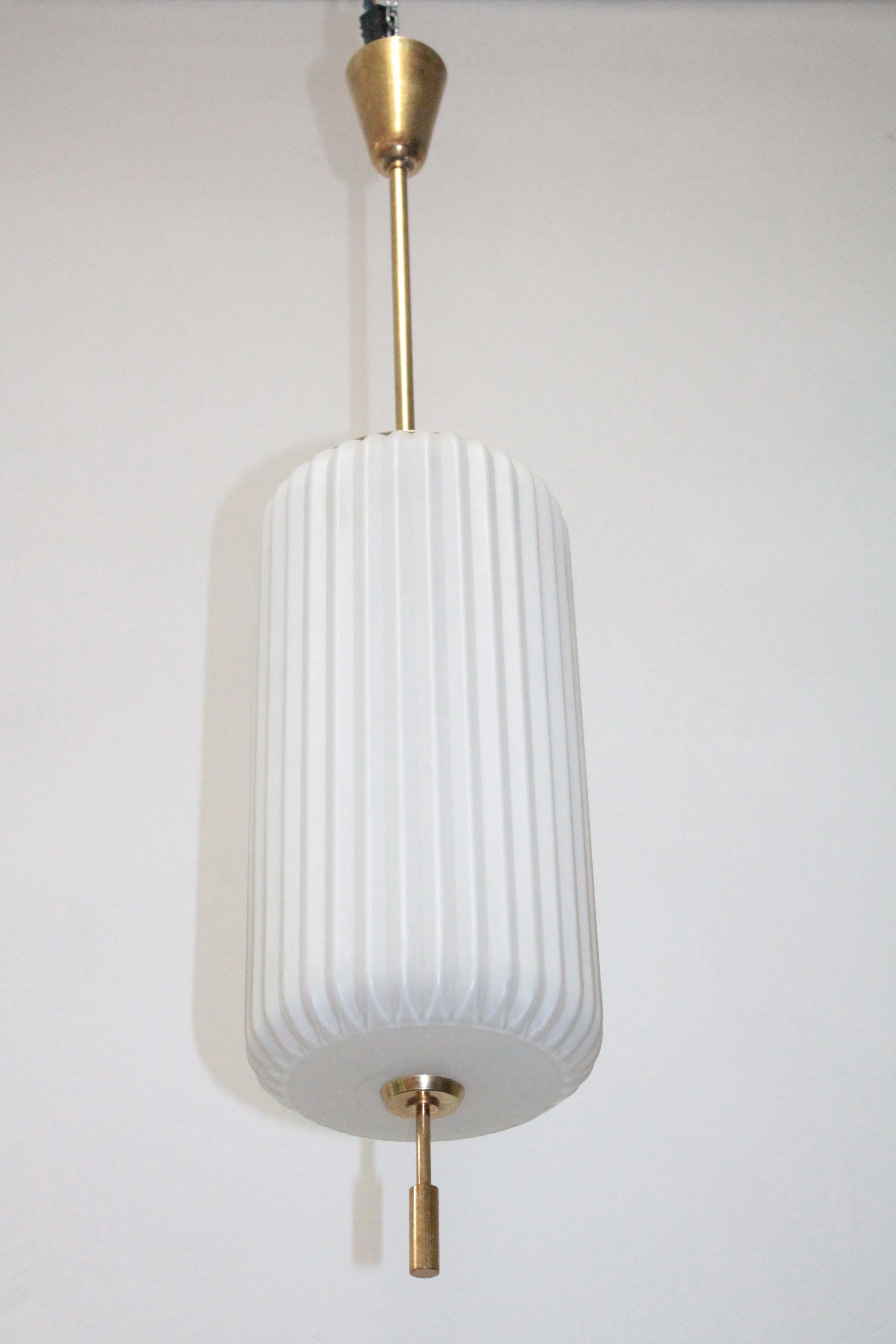 Pendant lamp by Arredoluce Mod 12766 design Angelo Lelii. 
Structure in polished brass, diffuser in duplex white opal glass 1959.
