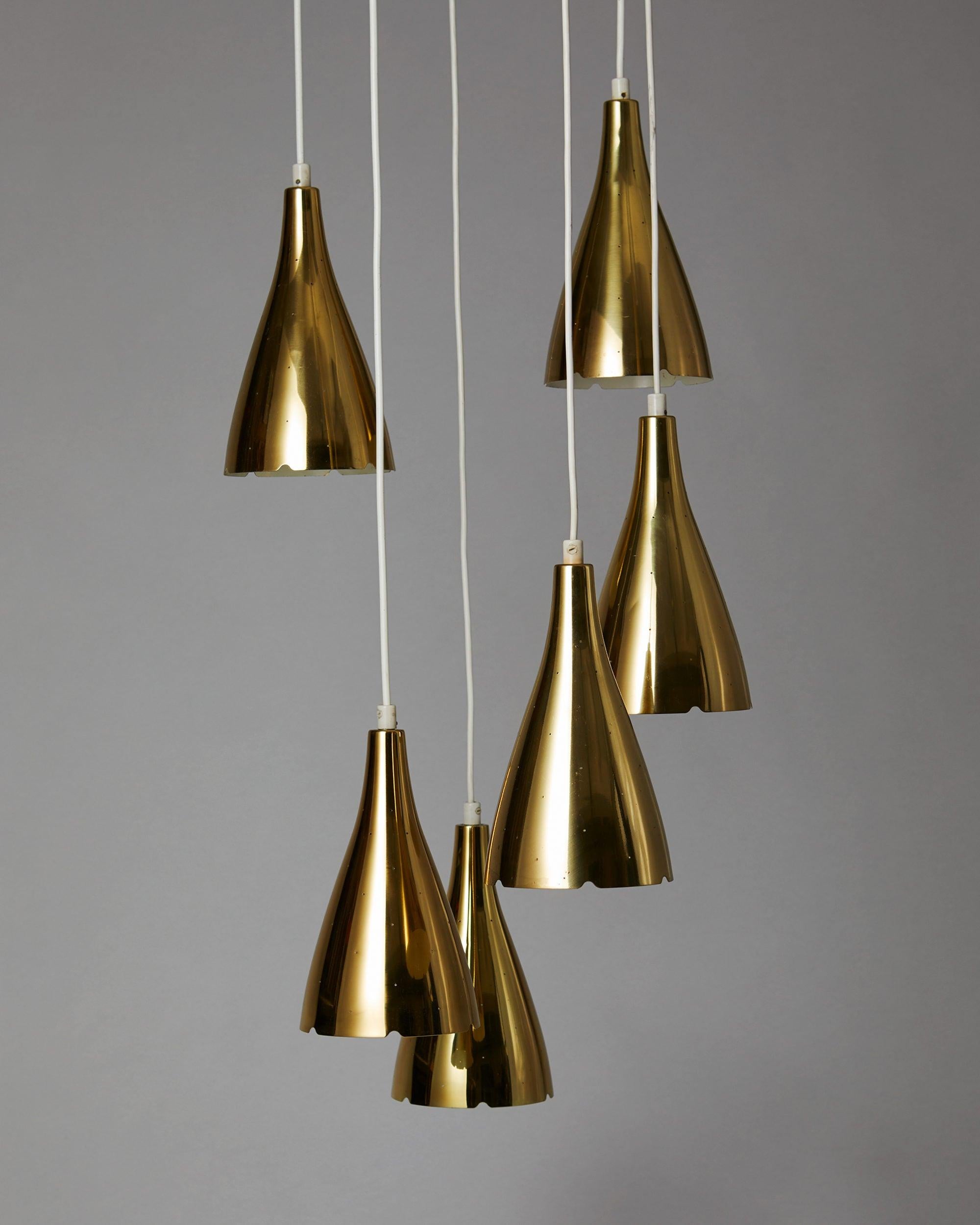 Ceiling lamp model 1994-1996 designed by Paavo Tynell for Taito Oy, Finland, 1953.

Brass with fabric cord.

Drop height variable.
Measures: Shade diameter 15 cm/ 6