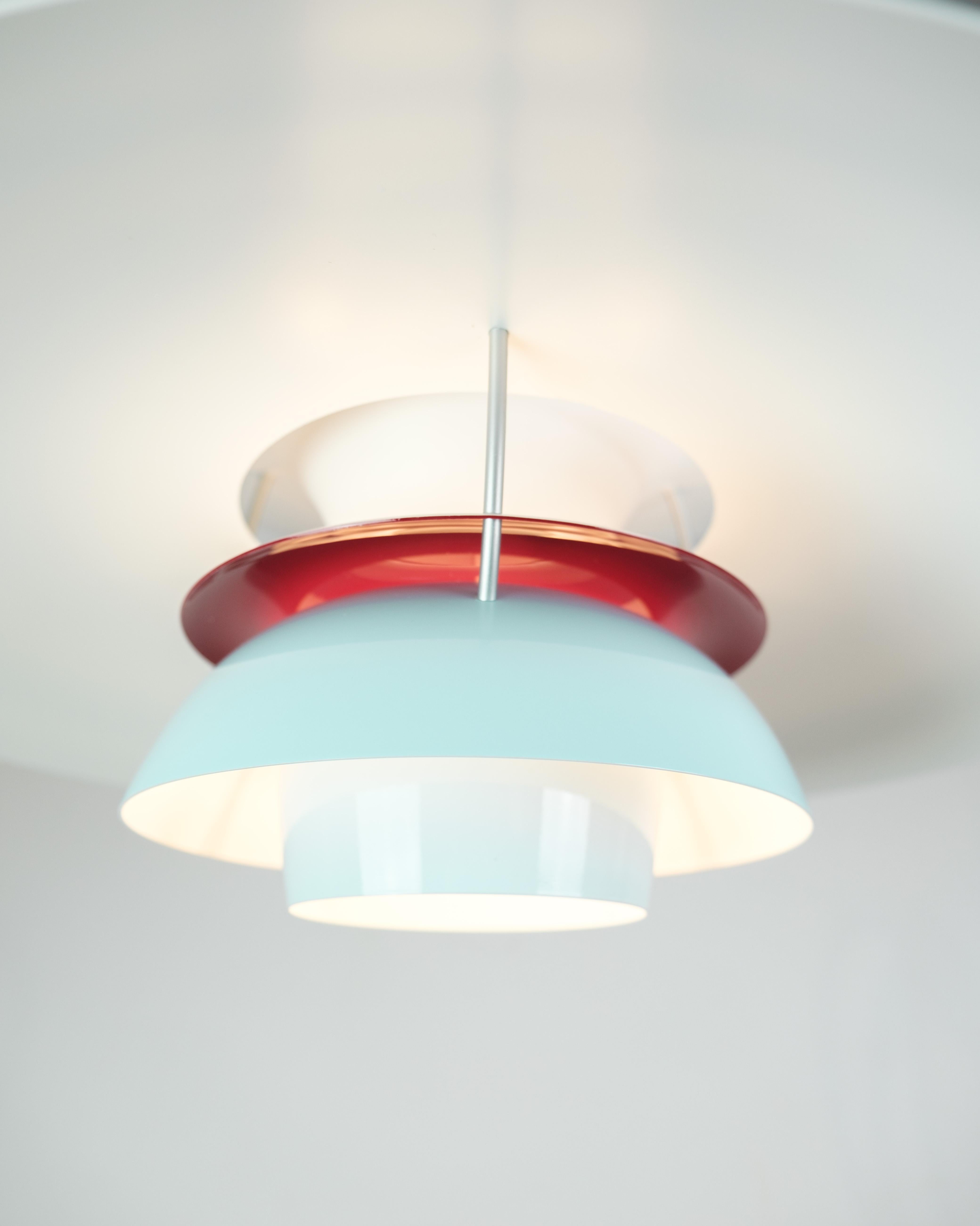 
The PH5 ceiling lamp, designed by Poul Henningsen and manufactured by Louis Poulsen, is an iconic piece of lighting design known for its innovative form and exceptional functionality. In this special edition, the lamp comes in a charming baby blue