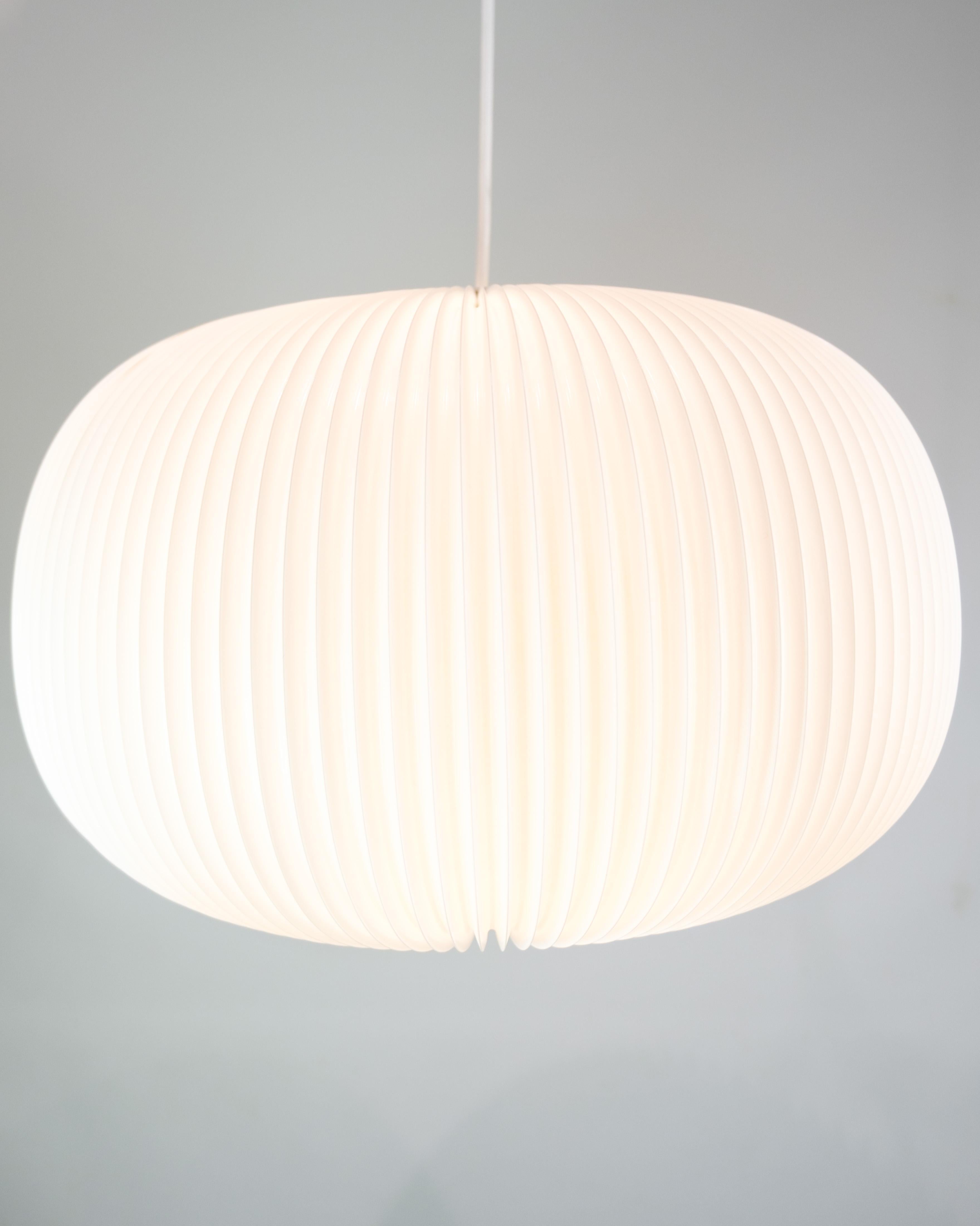 This ceiling lamp, part of the 132 Lamella Series, is an example of modern and elegant lighting design created by Hallgeir Homstvedt and Jonah Takagi. The lamp, in a silver model, is a beautiful combination of functionality and aesthetics.

132