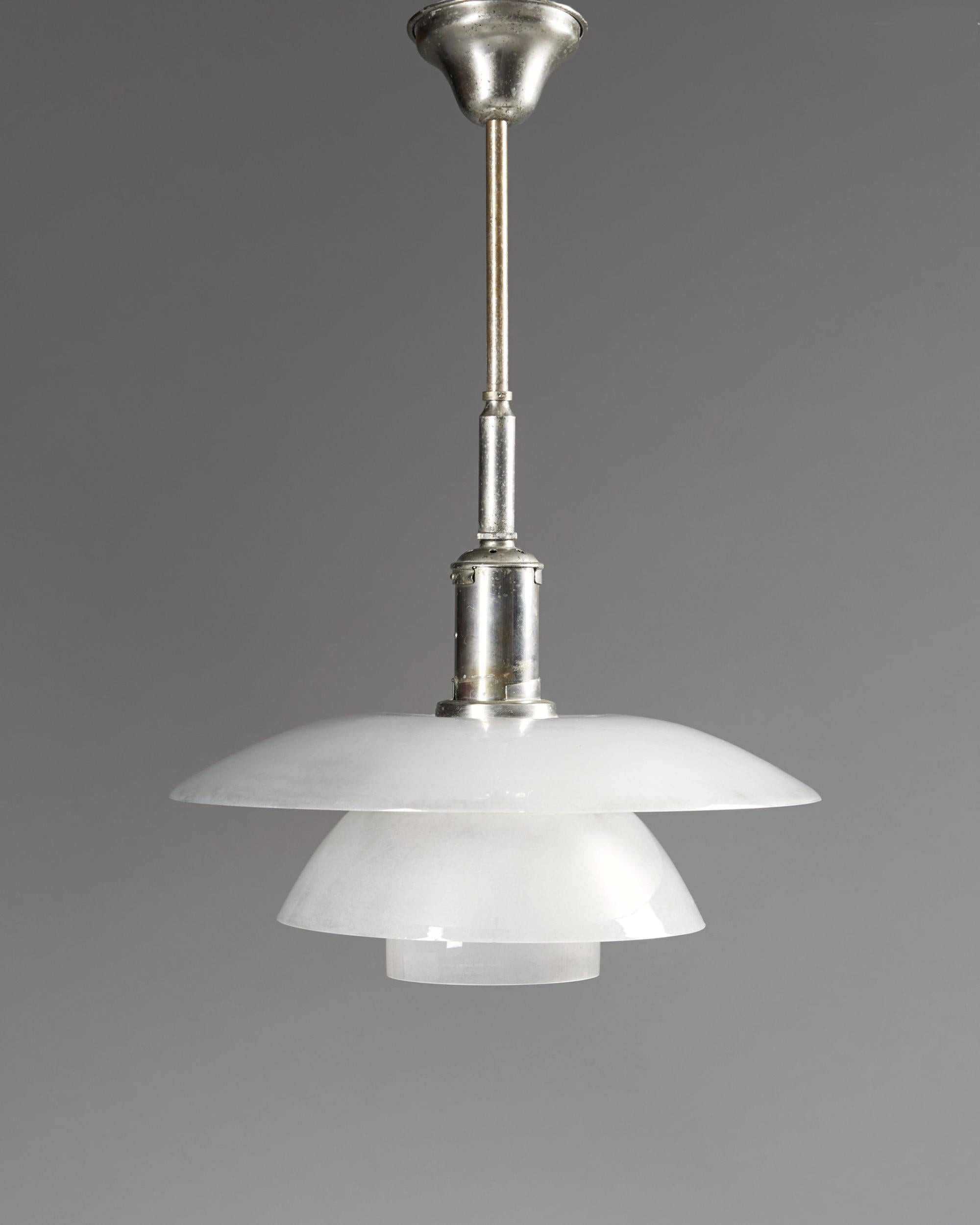Ceiling lamp PH 4/4 designed by Poul Henningsen for Louis Poulsen,
Denmark. 1930's.

Nickel plated brass and original glass.

Measurements:
D: 40 cm/ 15 3/4''