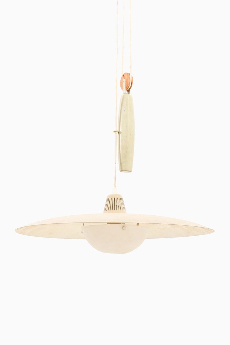 Rare height adjustable ceiling lamp by unknown designer. Produced by Bergbom in Sweden.