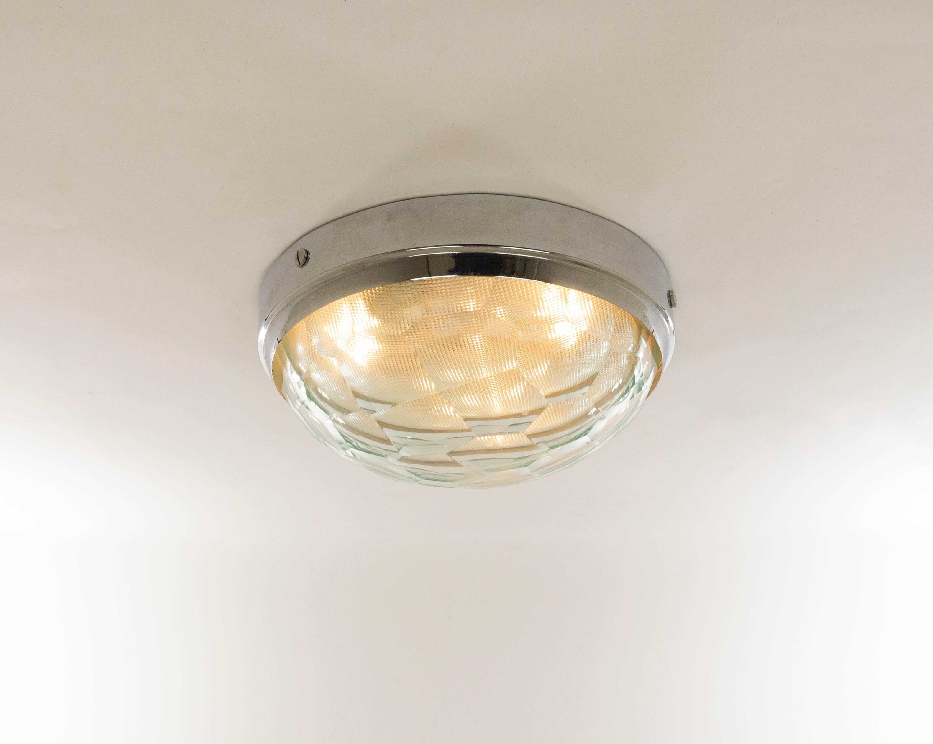 Ceiling or wall lamp with multifaceted glass designed by Pia Guidetti Crippa and manufactured by Lumi, in the 1960s.

The lamp consists of a chromed metal base and two layers of glass. The inner glass is textured while the outer glass is