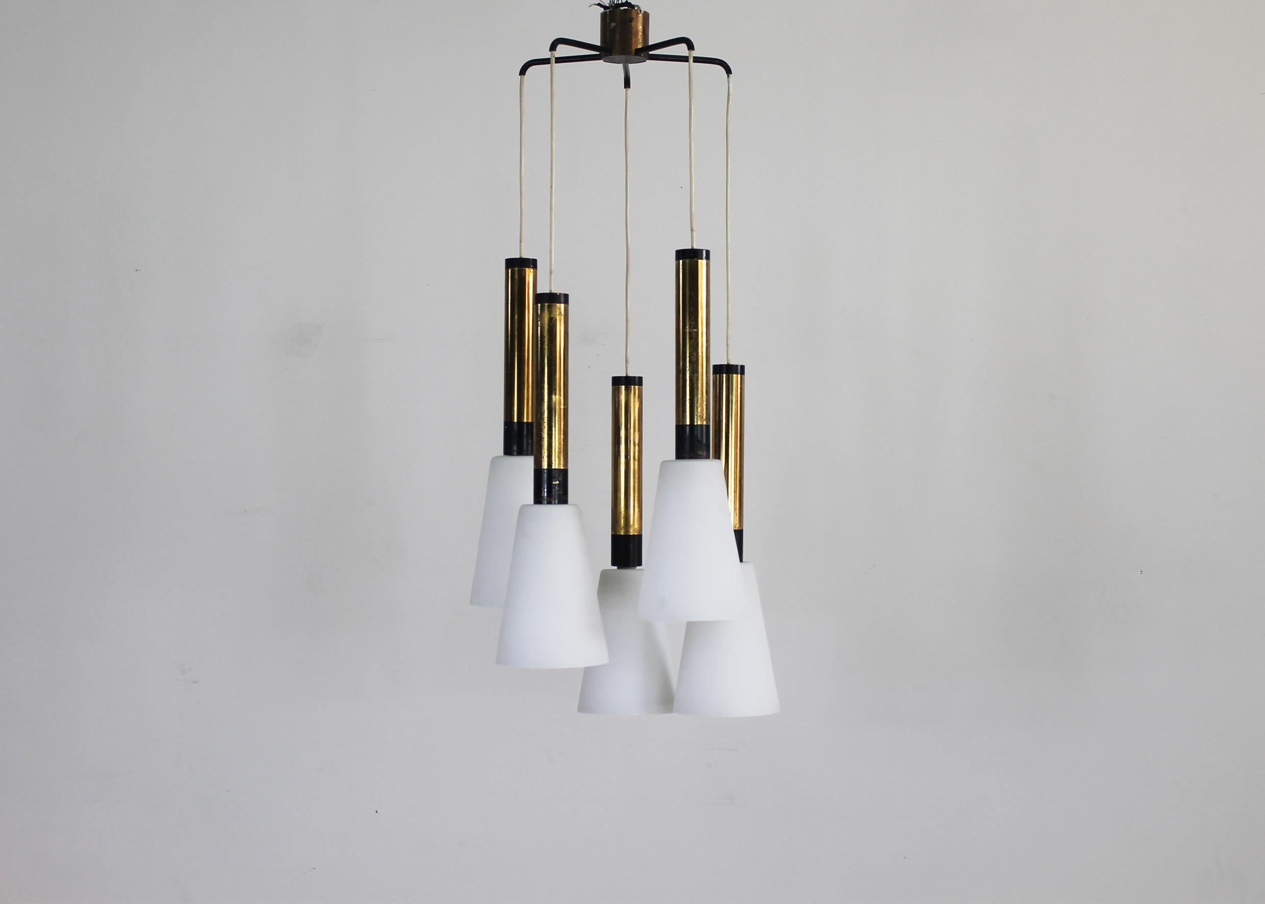 Pendant lamp with structure in lacquered metal and brass and five diffusers in opaline glass.
This lamp was manufactured by the Italian company Stilnovo during the 1960s.

Stilnovo was an important lighting company founded by Bruno Gatta in 1946.