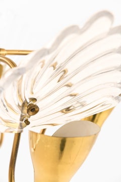 Ceiling Lamp with five gracefully curved brass arms by Carl Fagerlund, 1950s