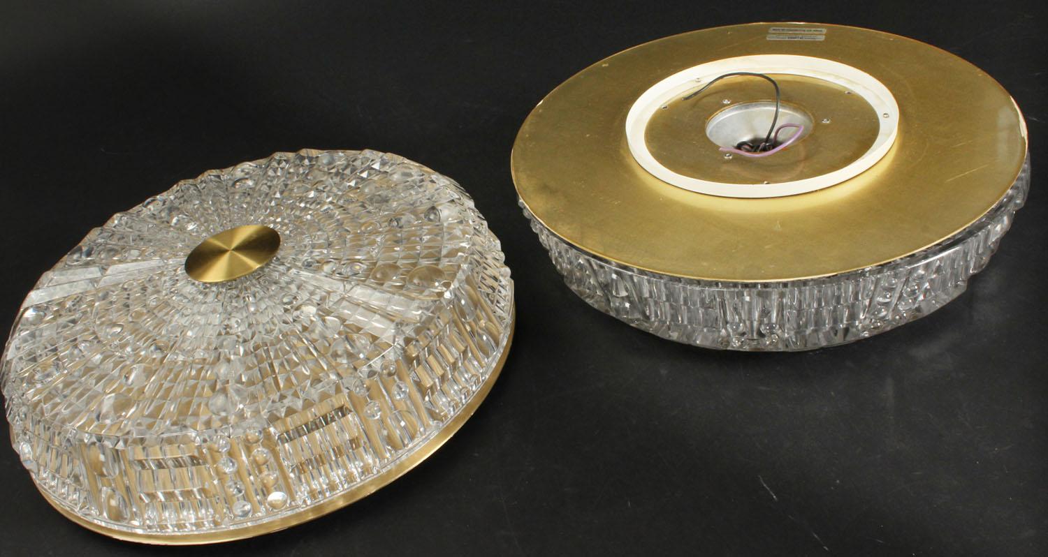 Carl Fagerlund for Orrefors. Ceiling lamps with screen of pressed clear glass, back plate and top of brass. Manufactured by Lyfa. 1960s-1970s. Ø 40 cm. Sold separately.