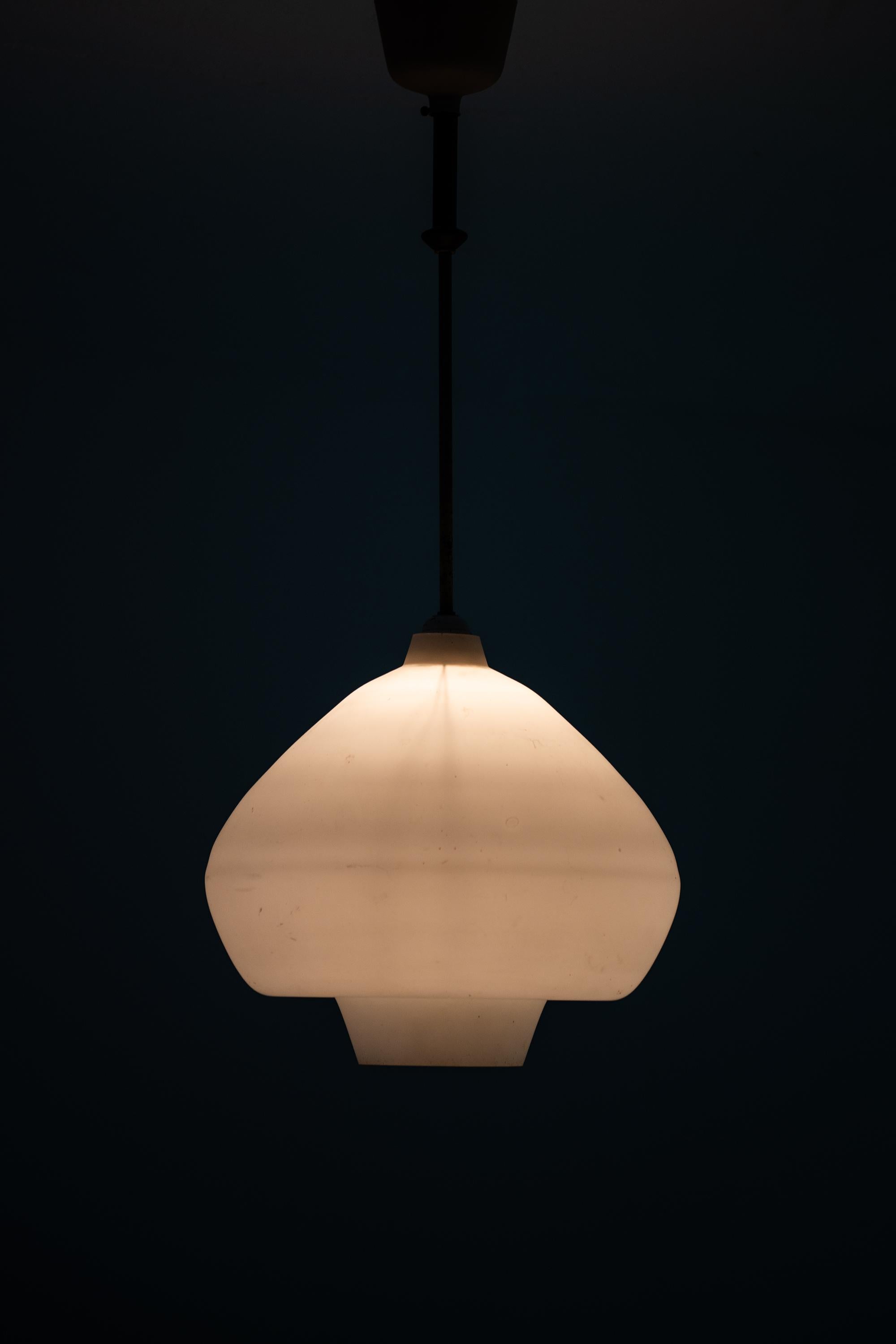 Scandinavian Modern Ceiling Lamps in Opal Glass and Teak Produced in Sweden