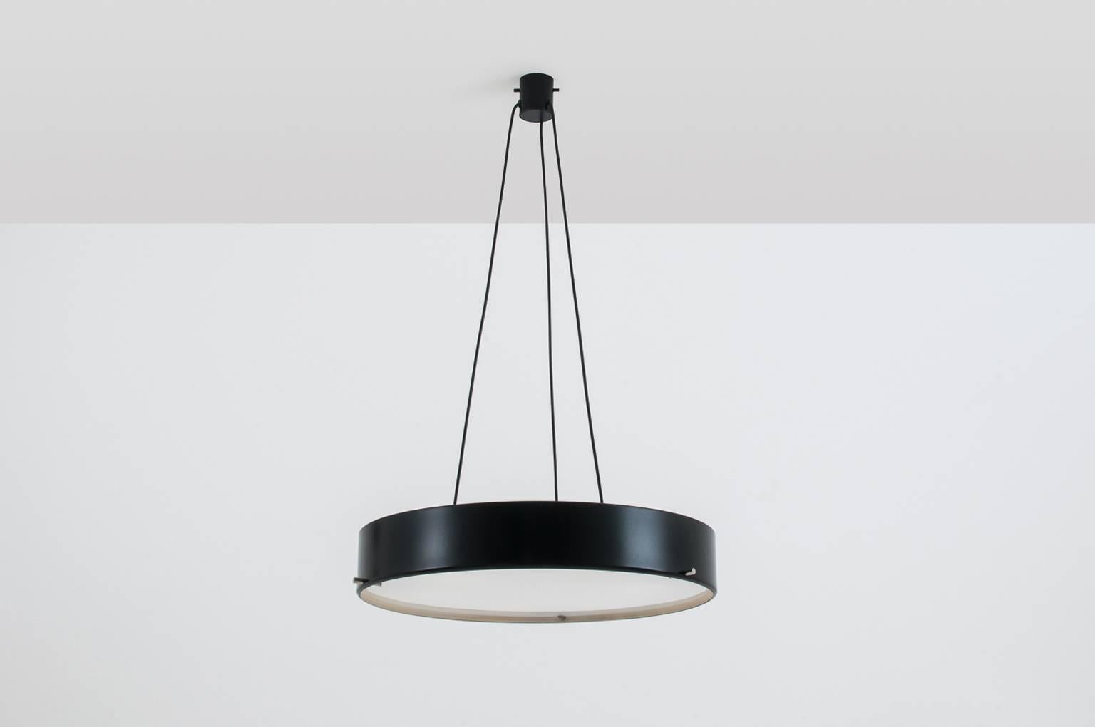 Sophisticated ceiling light ‘1090’ by Bruno Gatta for Stilnovo, Italy, 1954. Beautiful circular form made out of black lacquered aluminium, nickel details and opaline glass. The lamp provides a good light due to the six E-27 light sockets. The
