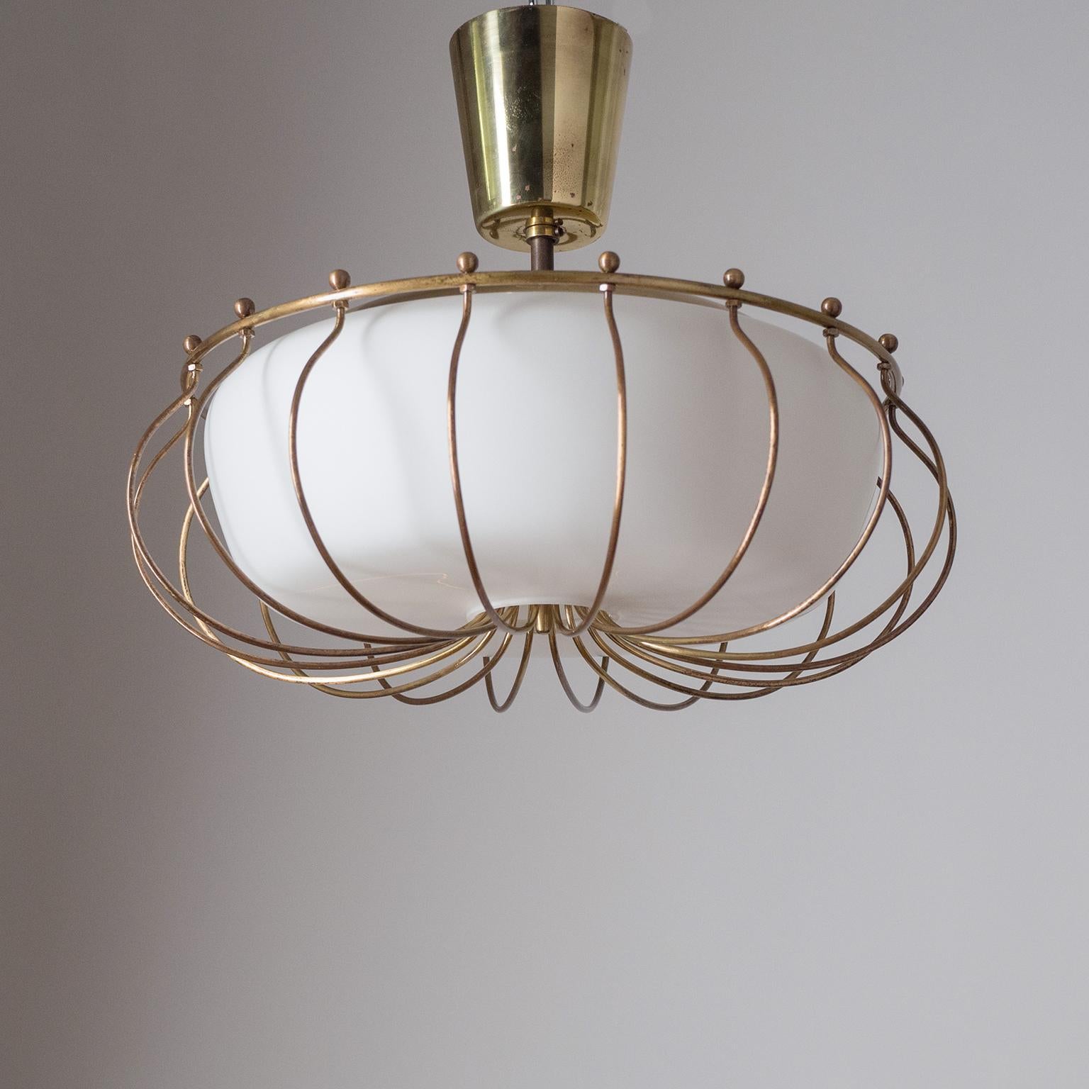 Rare brass and glass ceiling light from the 1940s attributed to J.T. Kalmar. The satin glass diffuser is surrounded by a brass cage-like structure. Three original brass and ceramic E14 sockets with new wiring.